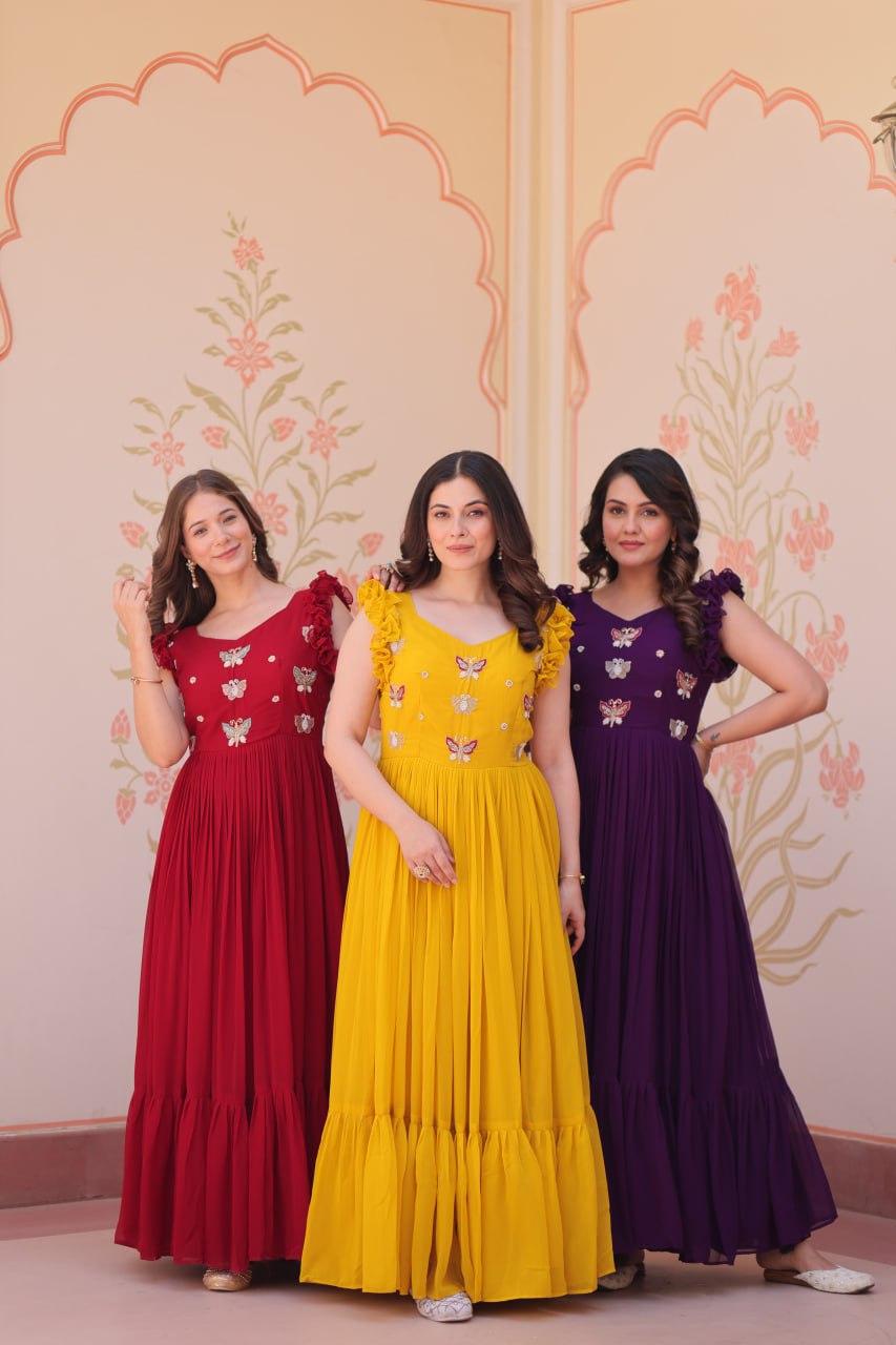 Lavi 7-meter flared designer gown in faux blooming fabric with sequin & bead embroidery, V-neck & frill shoulders – perfect for weddings & parties.