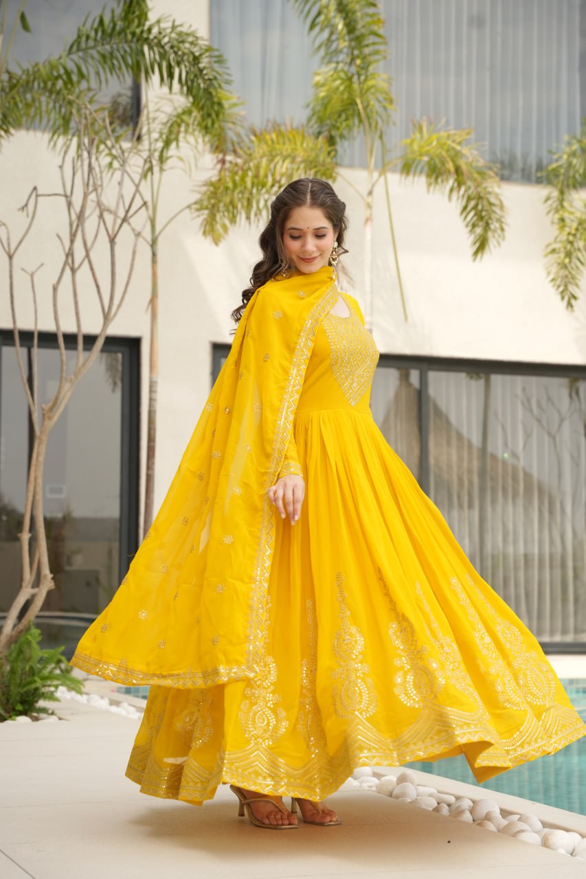 Yellow wedding gown for women with dupatta, embroidered gown design, full sleeve gown, Indian ethnic gown, stitched designer gown by Trinaari.