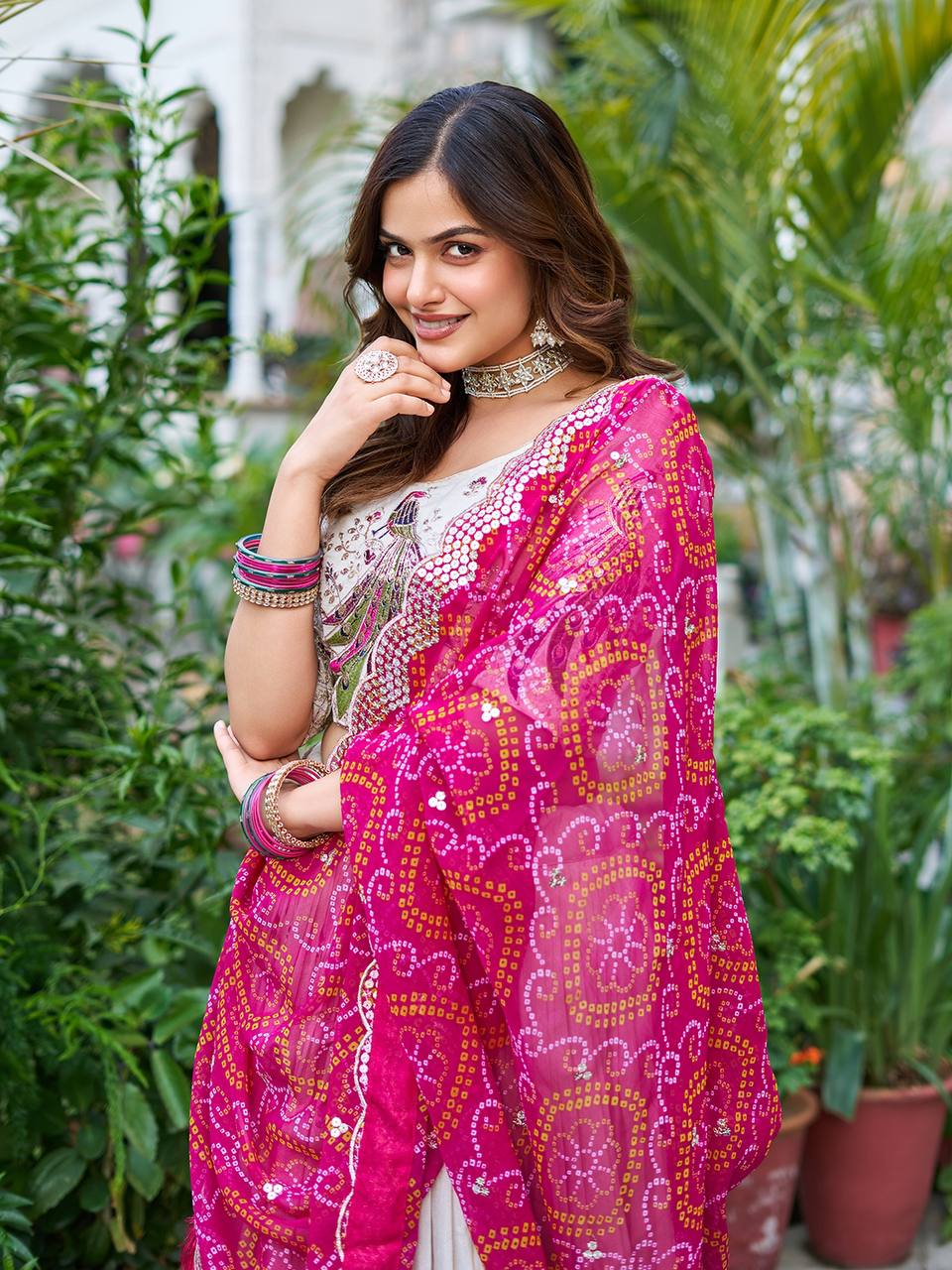 Amla Off-White Tissue Silk Sequins Thread Work Lehenga Choli with Pink Bandhej Dupatta