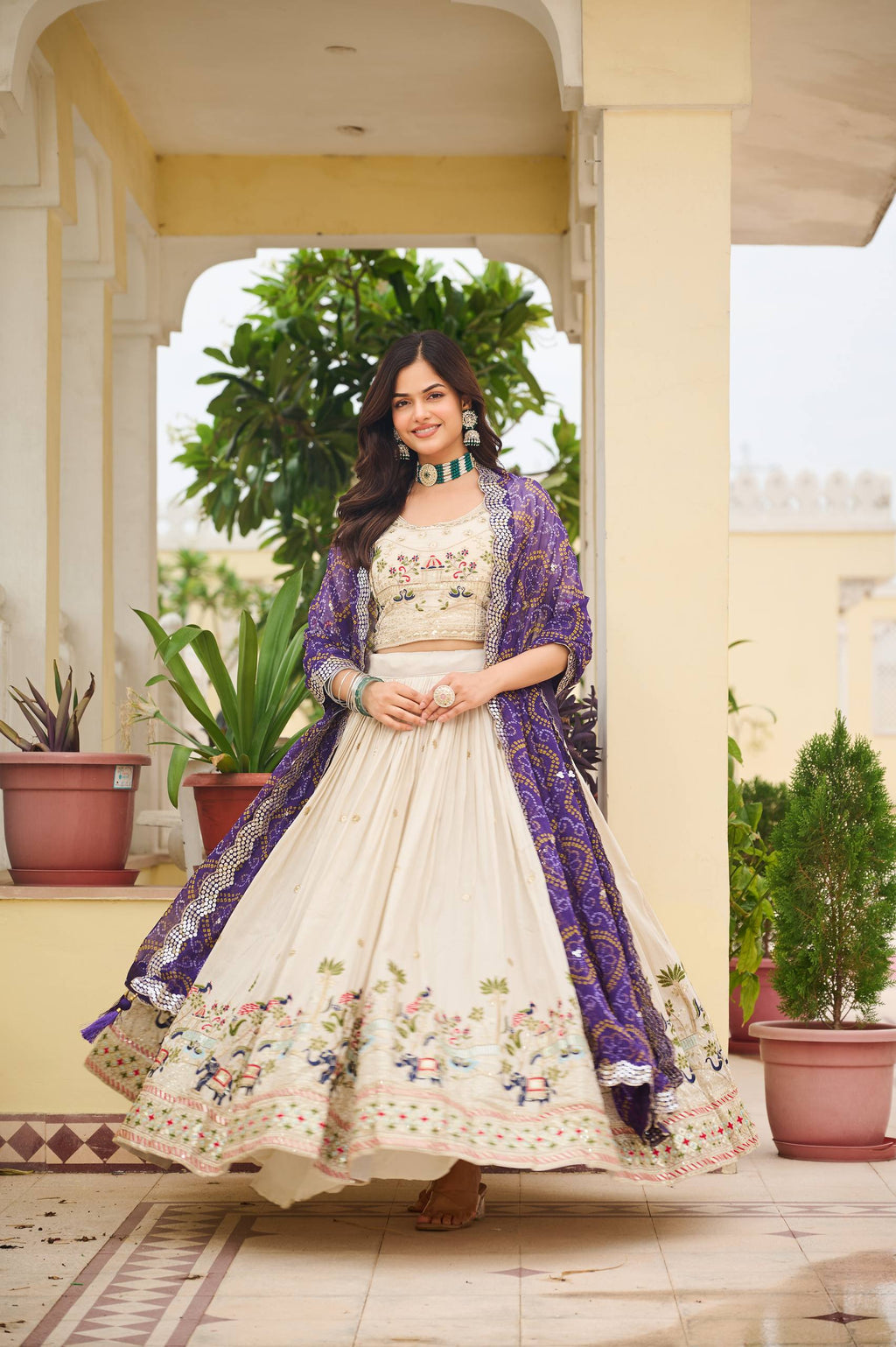 Off-white silk sequins thread embroidery lehenga choli with purple Bandhej dupatta