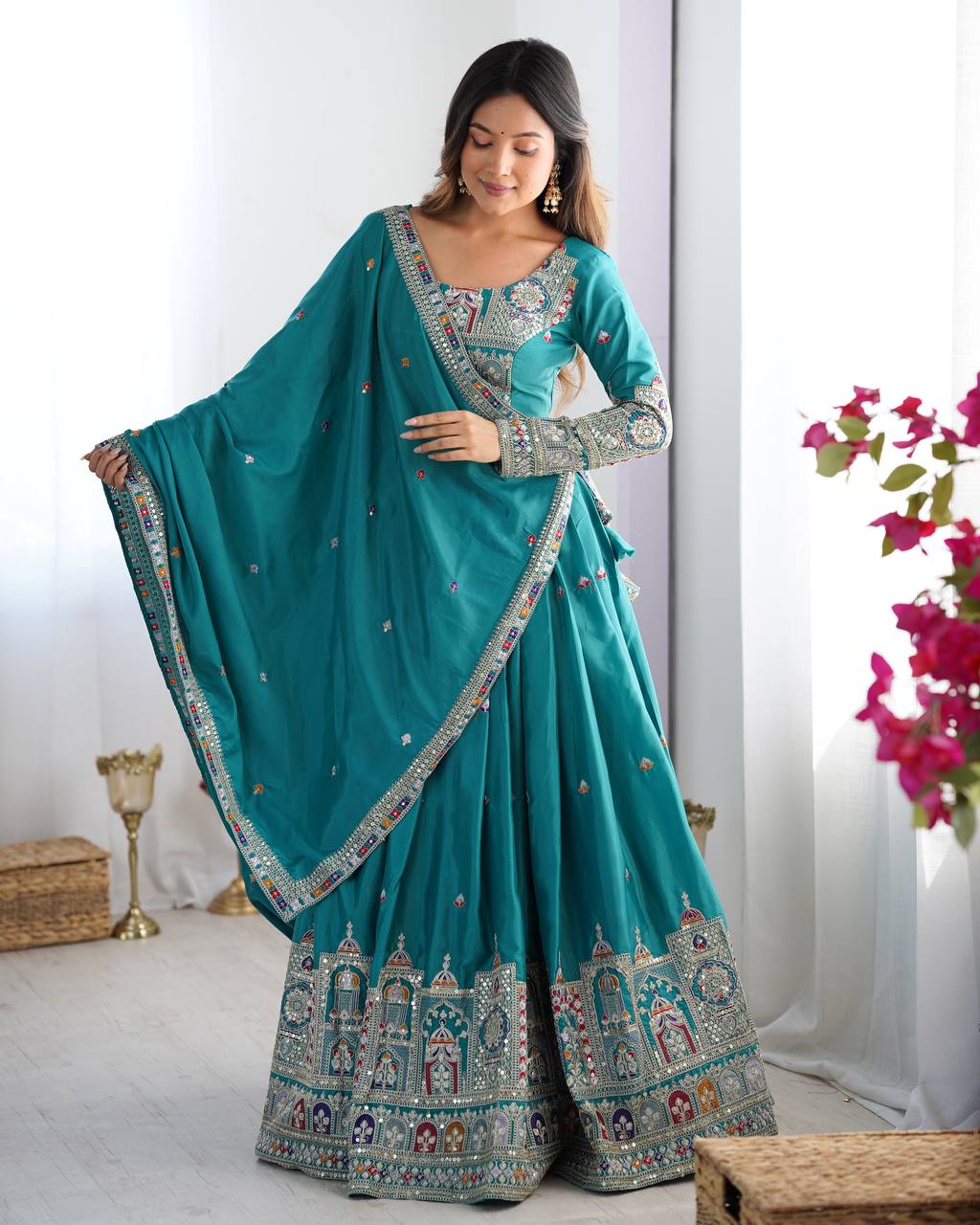 Kavyani Natural Crepe Silk Teal Color Lehenga Choli Set – semi-stitched lehenga with 3-meter flair, cancan and canvas patta, intricately embroidered with coding dori, thread, and sequins; paired with unstitched matching choli and embroidered dupatta with lace border, premium festive and wedding ethnic wear for women by Trinaari.