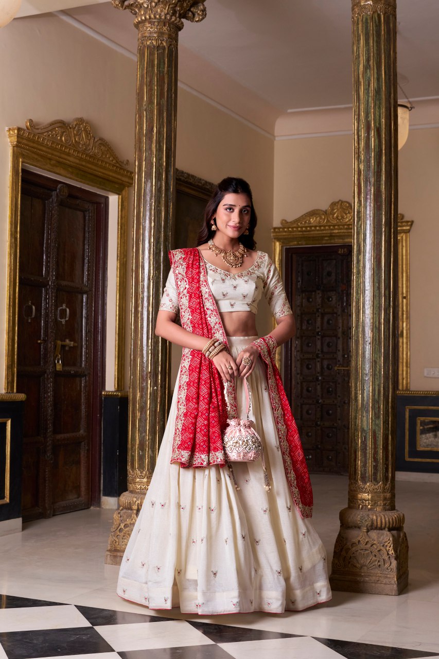 Off-white silk lehenga choli with embroidery and Bandhej print dupatta