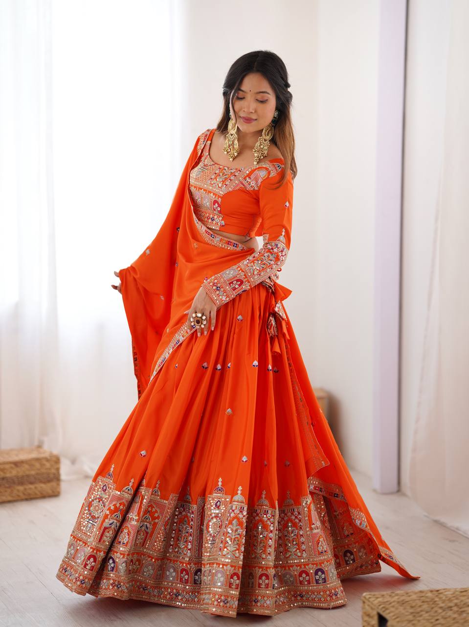 Kavyani Orange Crepe Silk Lehenga with dori-thread-sequin work, 3m flair & dupatta – semi-stitched festive wear for weddings.