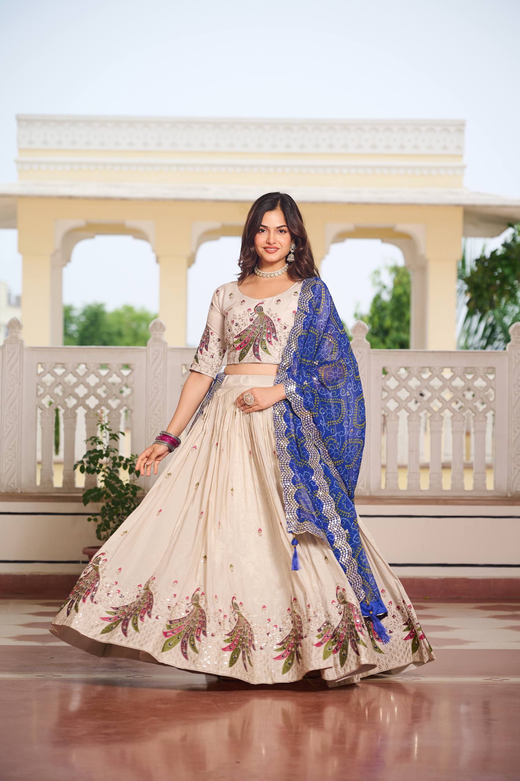 Amla Off-White Tissue Silk Sequins Thread Work Lehenga Choli with Blue Bandhej Dupatta