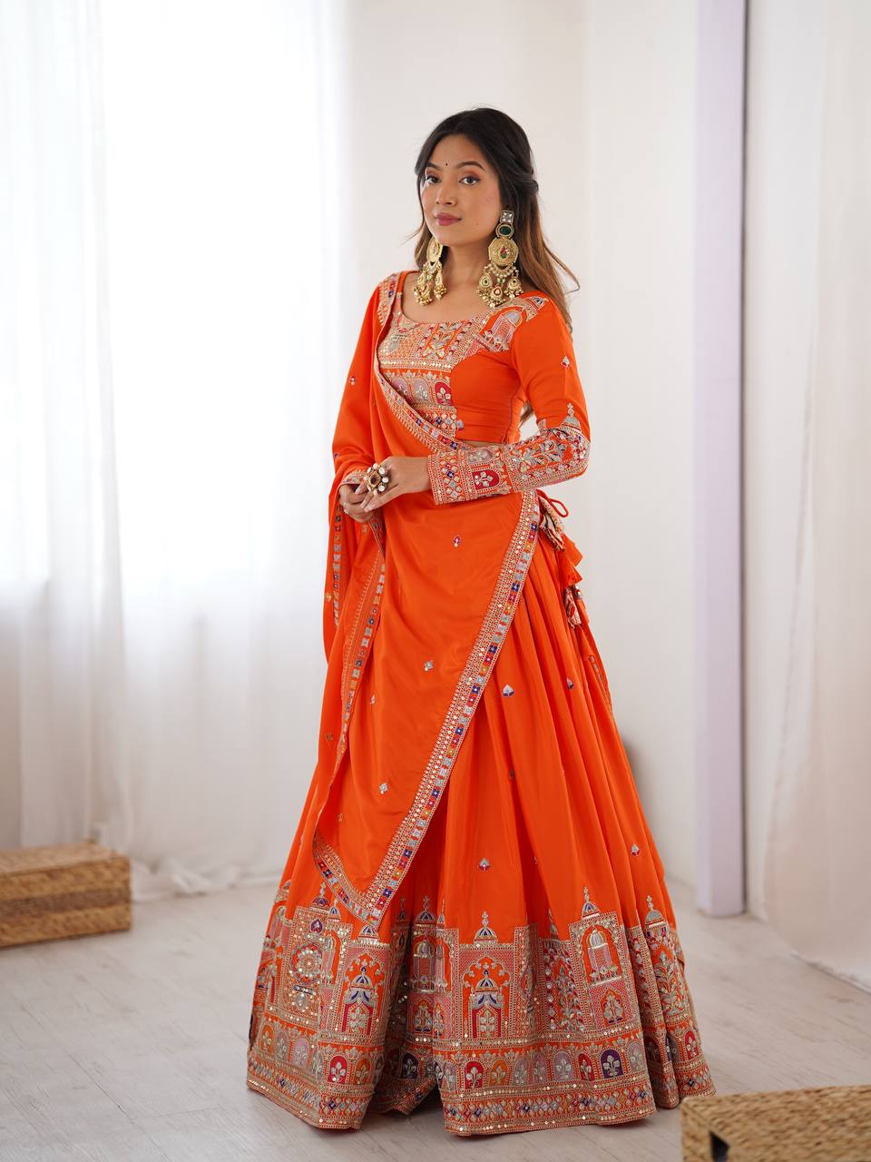 Kavyani Orange Crepe Silk Lehenga with dori-thread-sequin work, 3m flair & dupatta – semi-stitched festive wear for weddings.