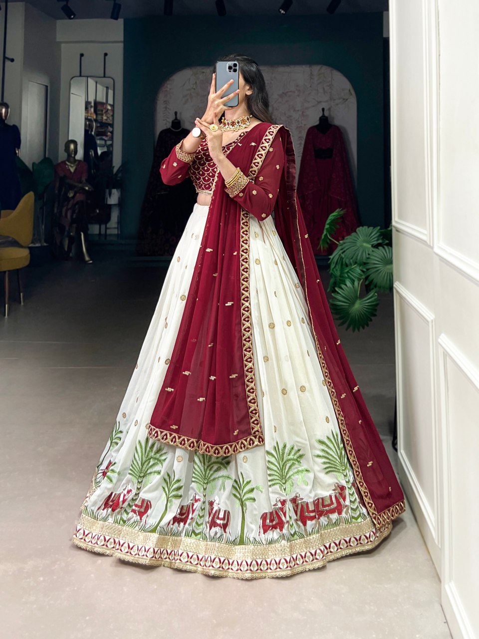 Bhavini Maroon Embroidered Georgette Lehenga Choli, featuring intricate sequins and thread embroidery with elegant lace detailing. The fully stitched lehenga has a 3.5-meter flair, can-can, and canvas stitching for a graceful silhouette. Paired with an unstitched embroidered georgette blouse and a matching dupatta with sequins work, this designer ensemble is perfect for weddings, festive occasions, and grand celebrations
