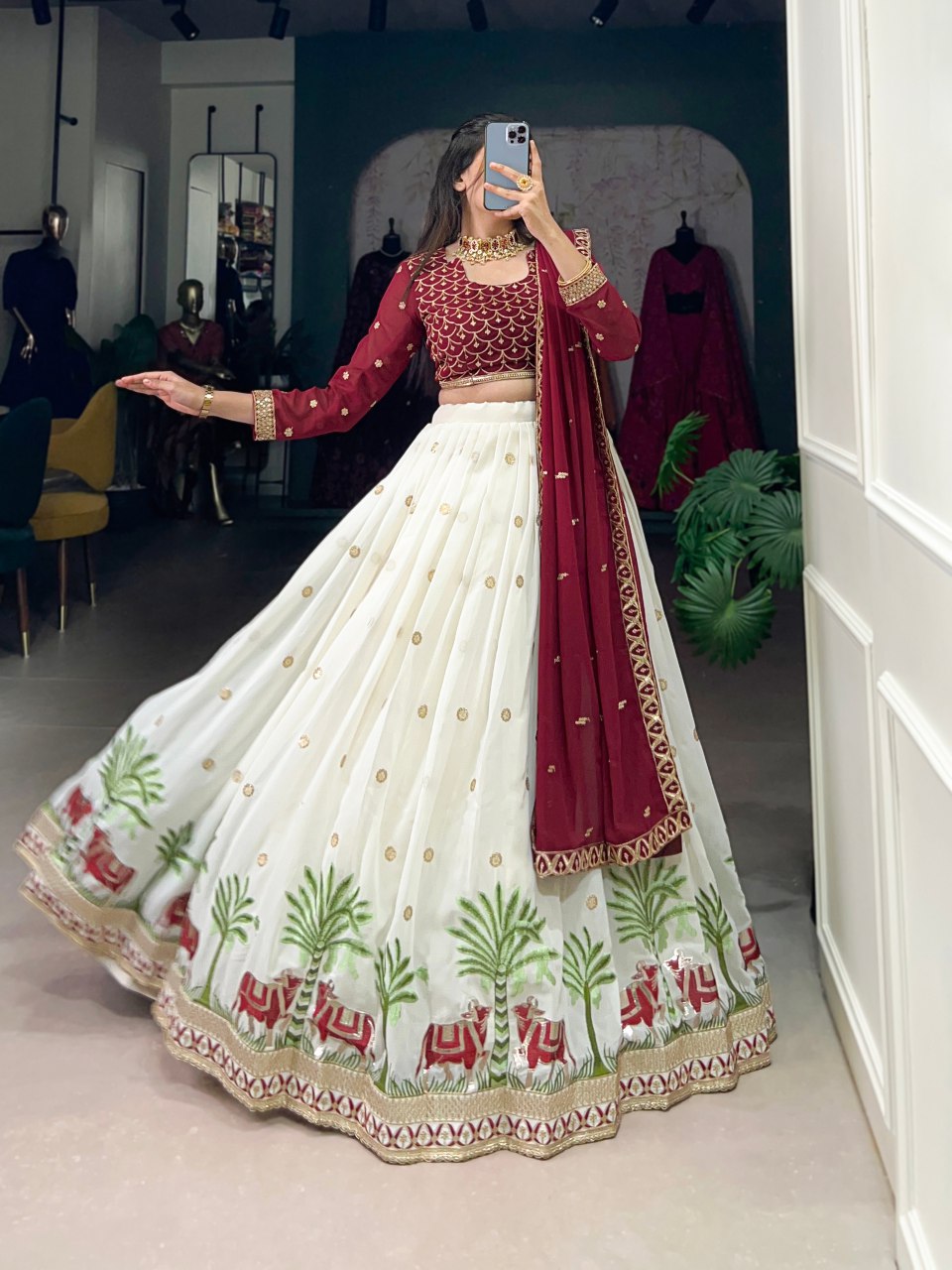 Bhavini Maroon Embroidered Georgette Lehenga Choli, featuring intricate sequins and thread embroidery with elegant lace detailing. The fully stitched lehenga has a 3.5-meter flair, can-can, and canvas stitching for a graceful silhouette. Paired with an unstitched embroidered georgette blouse and a matching dupatta with sequins work, this designer ensemble is perfect for weddings, festive occasions, and grand celebrations
