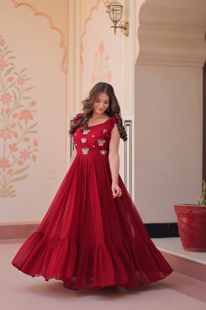 Lavi 7-meter flared designer gown in faux blooming fabric with sequin & bead embroidery, V-neck & frill shoulders – perfect for weddings & parties.