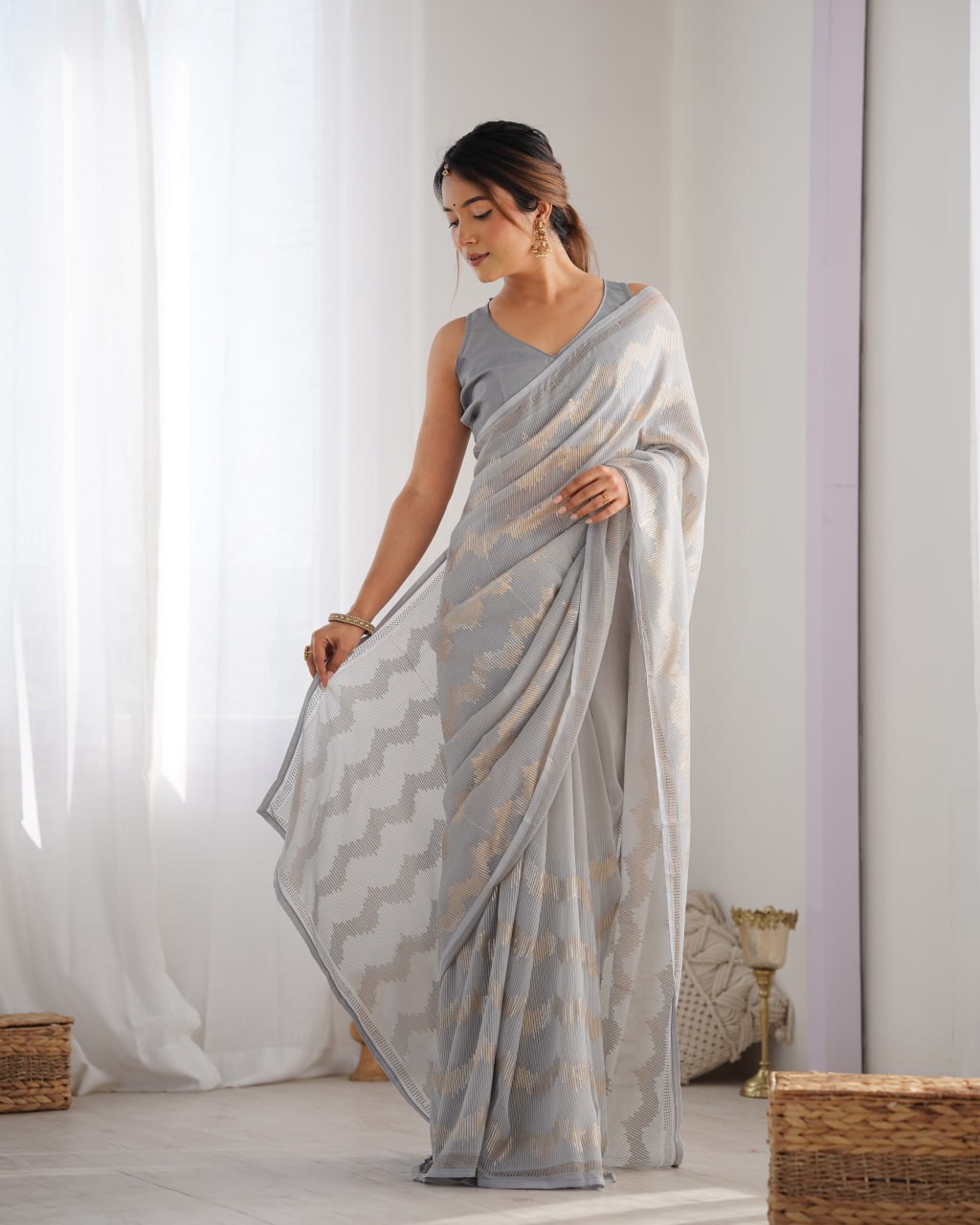 Graceful Aira Grey Georgette saree with heavy sequin embroidery and Seroski diamond embellishments, paired with an unstitched satin Banglori blouse – ideal bridal saree, festive saree, designer grey saree, elegant ethnic party wear, and luxury embroidered saree for women.