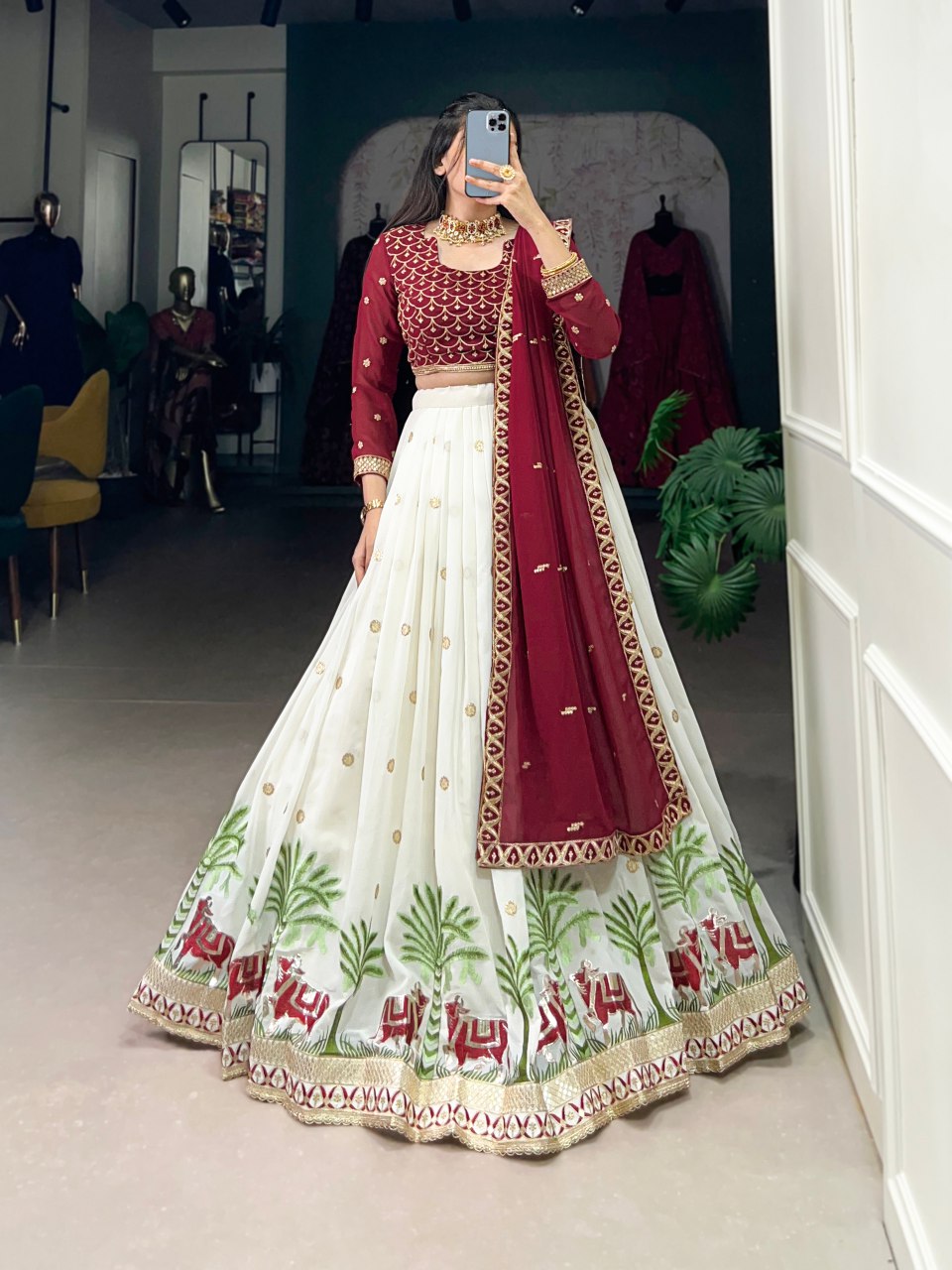 Bhavini Maroon Embroidered Georgette Lehenga Choli, featuring intricate sequins and thread embroidery with elegant lace detailing. The fully stitched lehenga has a 3.5-meter flair, can-can, and canvas stitching for a graceful silhouette. Paired with an unstitched embroidered georgette blouse and a matching dupatta with sequins work, this designer ensemble is perfect for weddings, festive occasions, and grand celebrations
