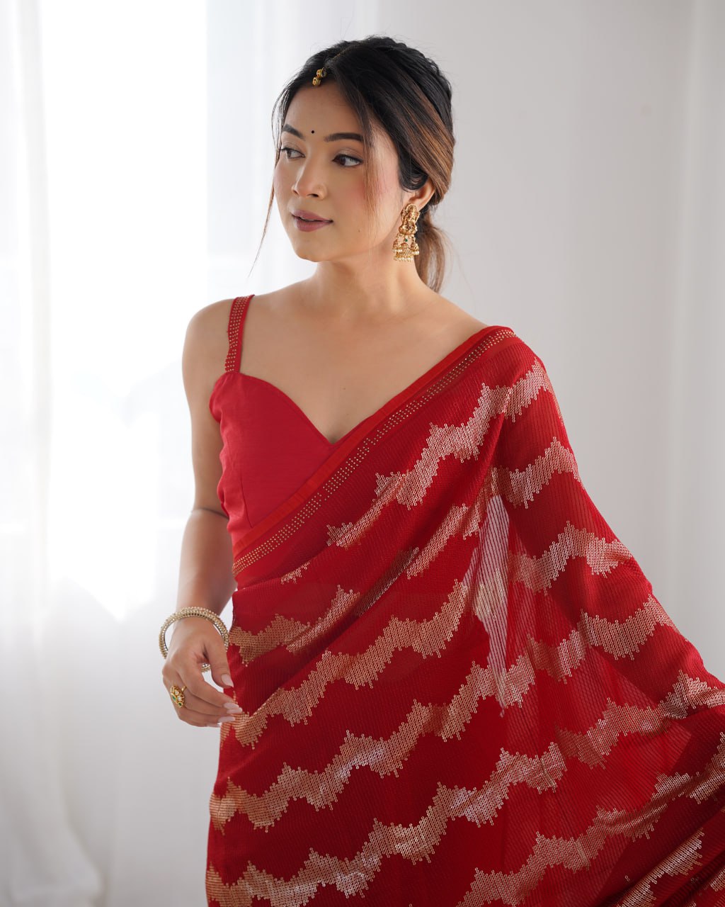 Red georgette saree with sequin & Seroski diamond work, bridal party wear saree with satin blouse, designer ethnic wear by Trinaari for weddings.