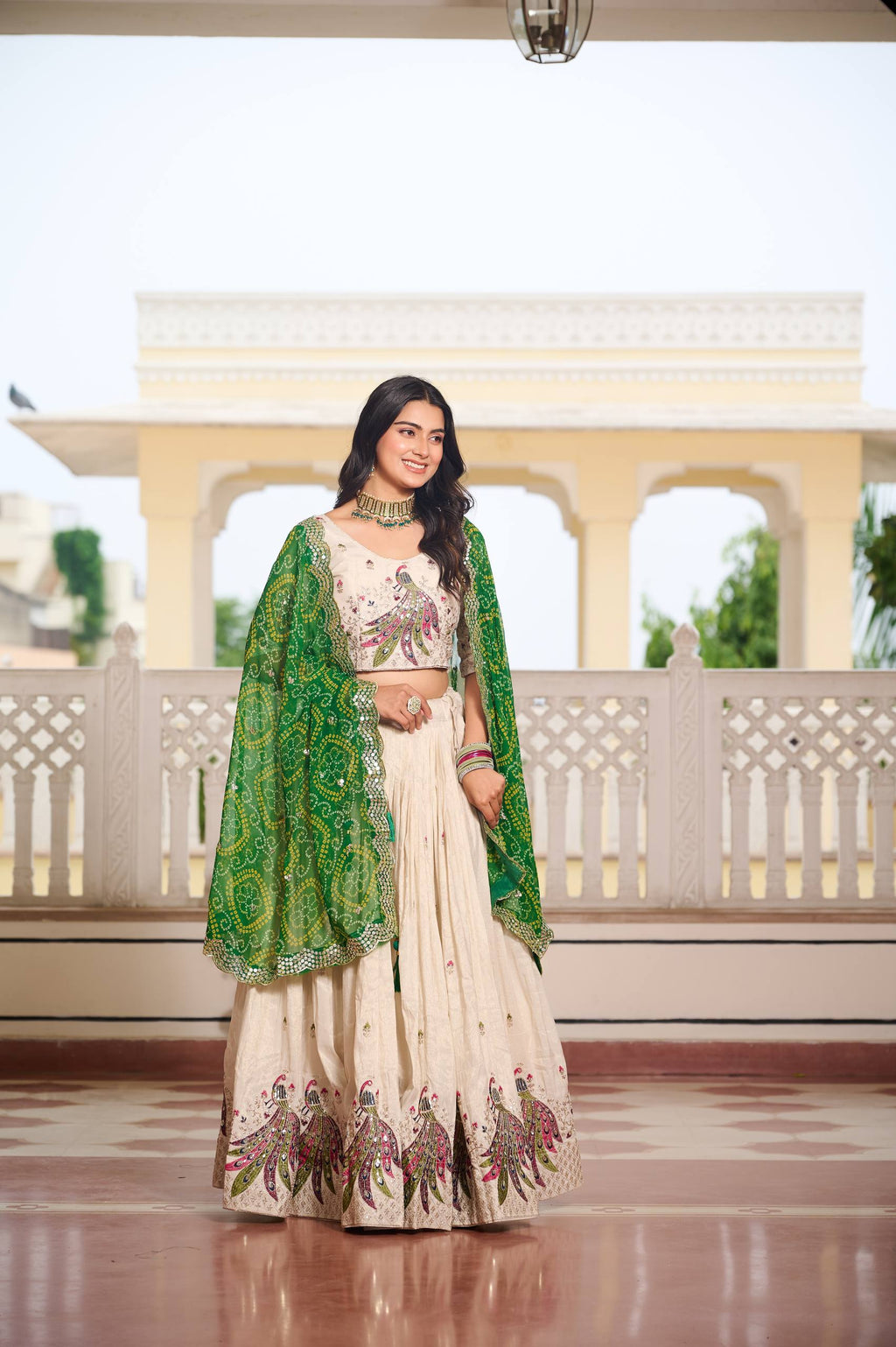 Amla off-white tissue silk lehenga choli with sequins thread work and green Bandhej dupatta