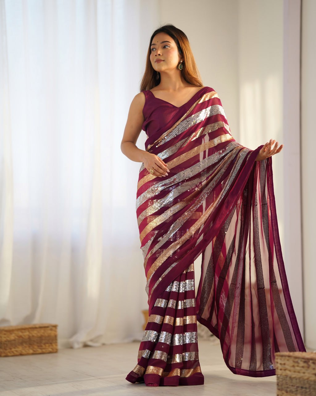 Kira Wine Georgette Saree with 3MM to 7MM sequin embroidery, elegant lining pattern and mono Banglory blouse – ideal sequin saree for wedding receptions, cocktail parties, festive wear, and premium Bollywood-style designer look.