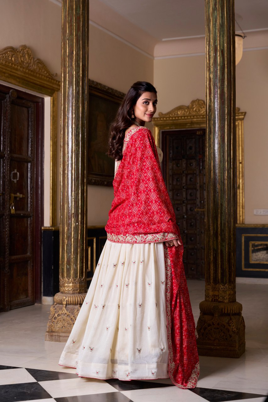 Off-white silk lehenga choli with embroidery and Bandhej print dupatta