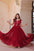 Lavi 7-meter flared designer gown in faux blooming fabric with sequin & bead embroidery, V-neck & frill shoulders – perfect for weddings & parties.