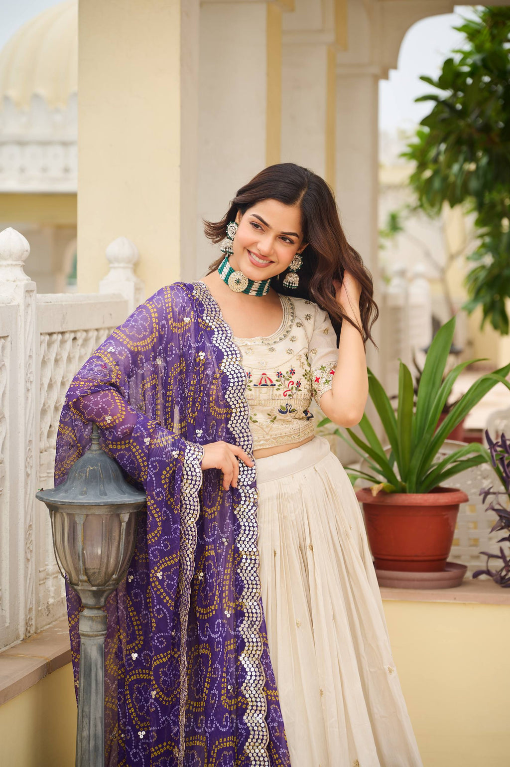 Off-white silk sequins thread embroidery lehenga choli with purple Bandhej dupatta