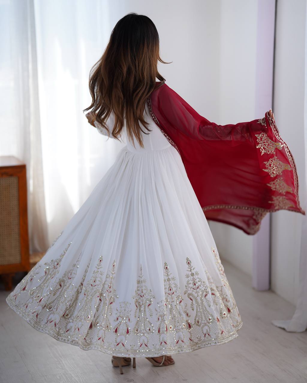 Tejvini White Embroidered Gown Set – heavy georgette gown with multi-thread 5mm sequin embroidery, full sleeves, soft cotton inner, paired with contrasting maroon embroidered dupatta and stitched bottom – ideal for weddings, receptions, and festive occasions.