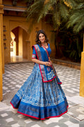 Girija Blue Color Dola Silk Batik Print With Zari
Weaving Work Lehenga Choli