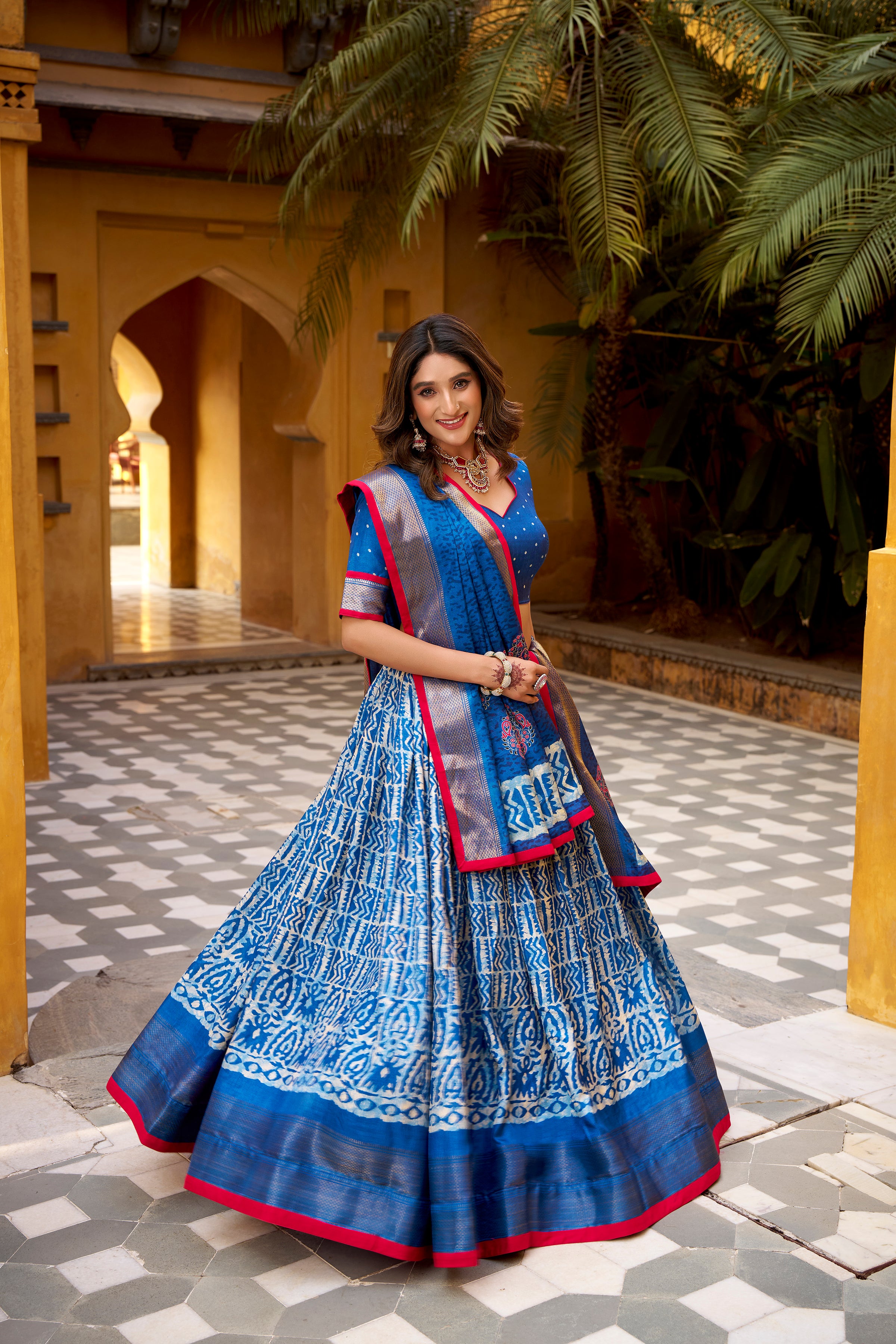 Girija Blue Color Dola Silk Batik Print With Zari
Weaving Work Lehenga Choli