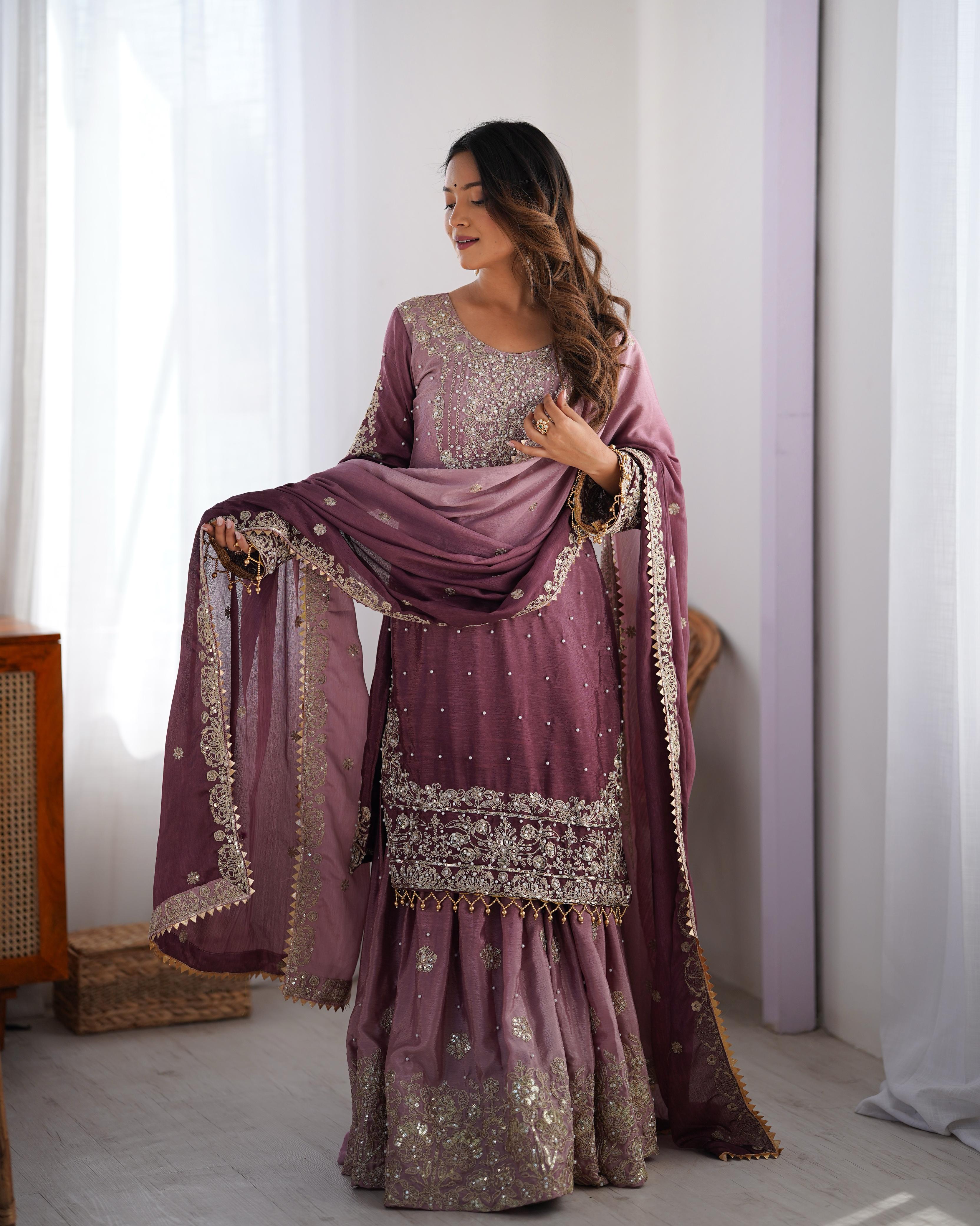 This Manvisha Pink Embroidered Sharara Suit Set is a premium choice for wedding wear, partywear sharara suits, and festive ethnic outfits. Made from luxurious Chinon silk, this designer sharara set features intricate cording dori embroidery, sequins work, and rivet moti detailing, making it perfect for Indian wedding outfits. The fully stitched kurta showcases embroidery on both the front and back, complementing the stylish embroidered sharara pants with an elastic waistband for a comfortable fit. Paired wi