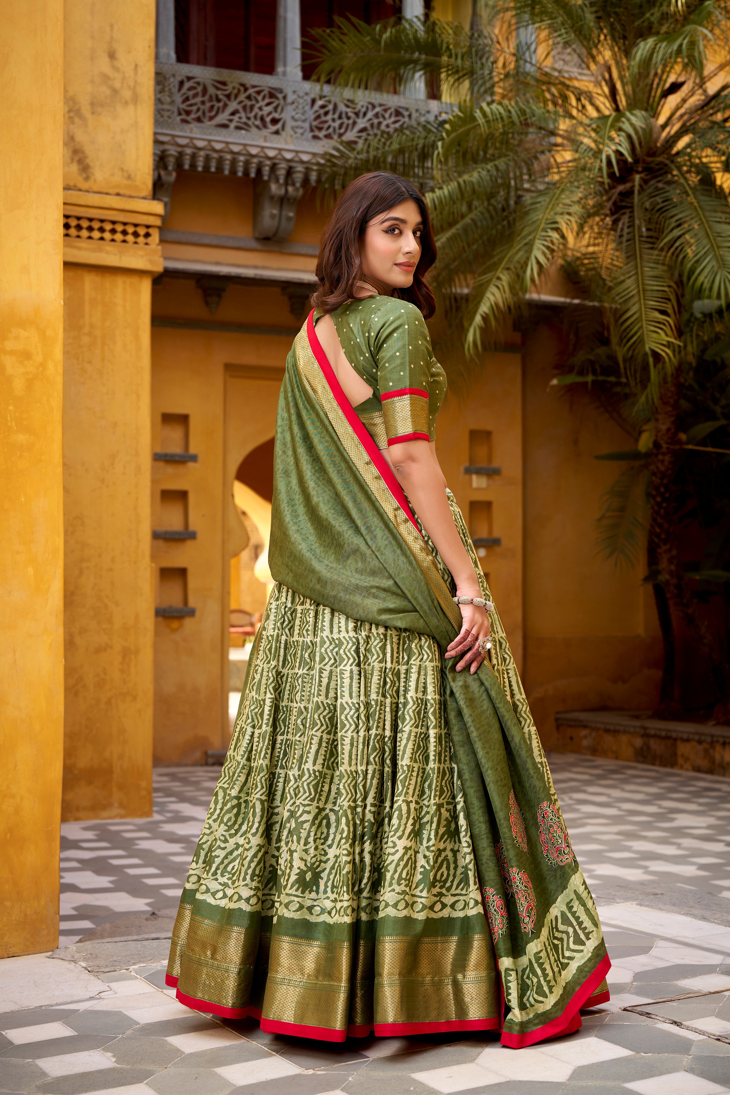 Girija Mehendi Green Dola Silk Batik Print With Zari
Weaving Work Lehenga Choli