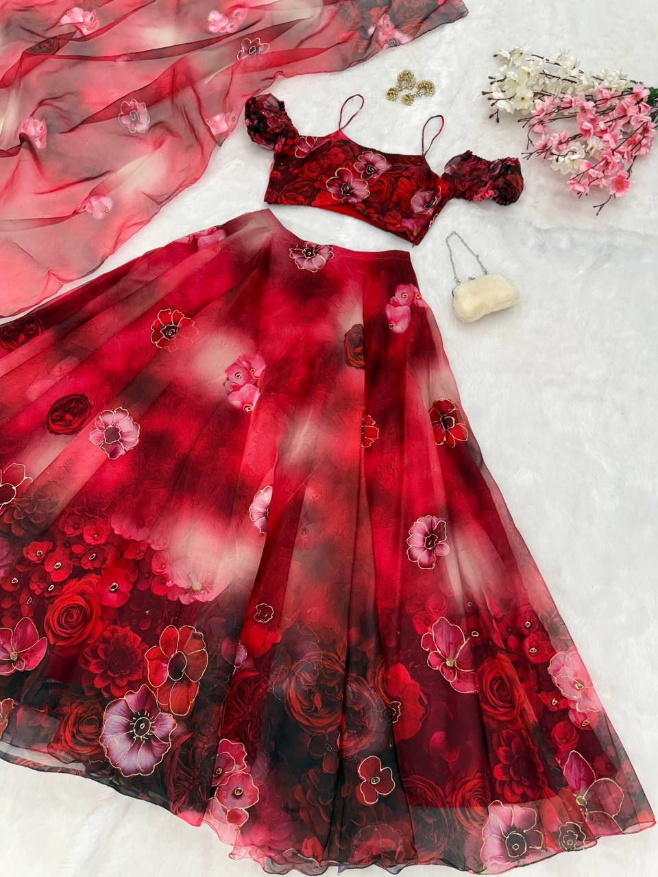 Red pure organza digital print zari work lehenga choli with batwa bag