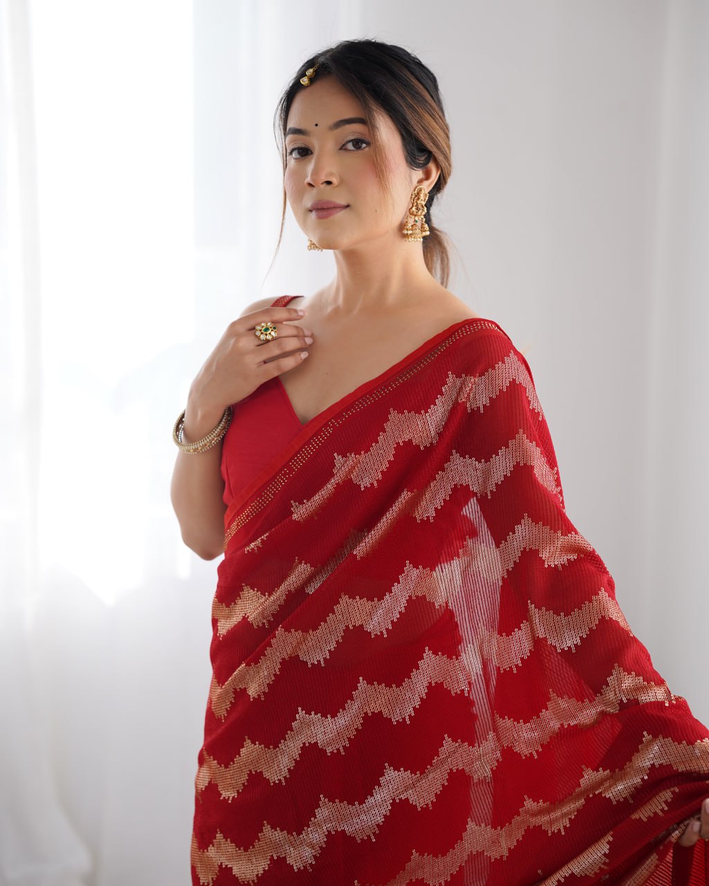 Red georgette saree with sequin & Seroski diamond work, bridal party wear saree with satin blouse, designer ethnic wear by Trinaari for weddings.