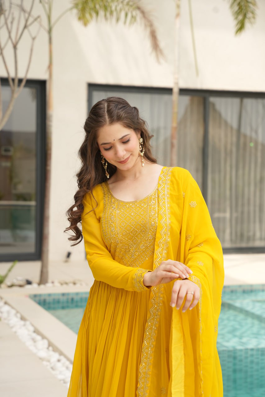 Yellow wedding gown for women with dupatta, embroidered gown design, full sleeve gown, Indian ethnic gown, stitched designer gown by Trinaari.