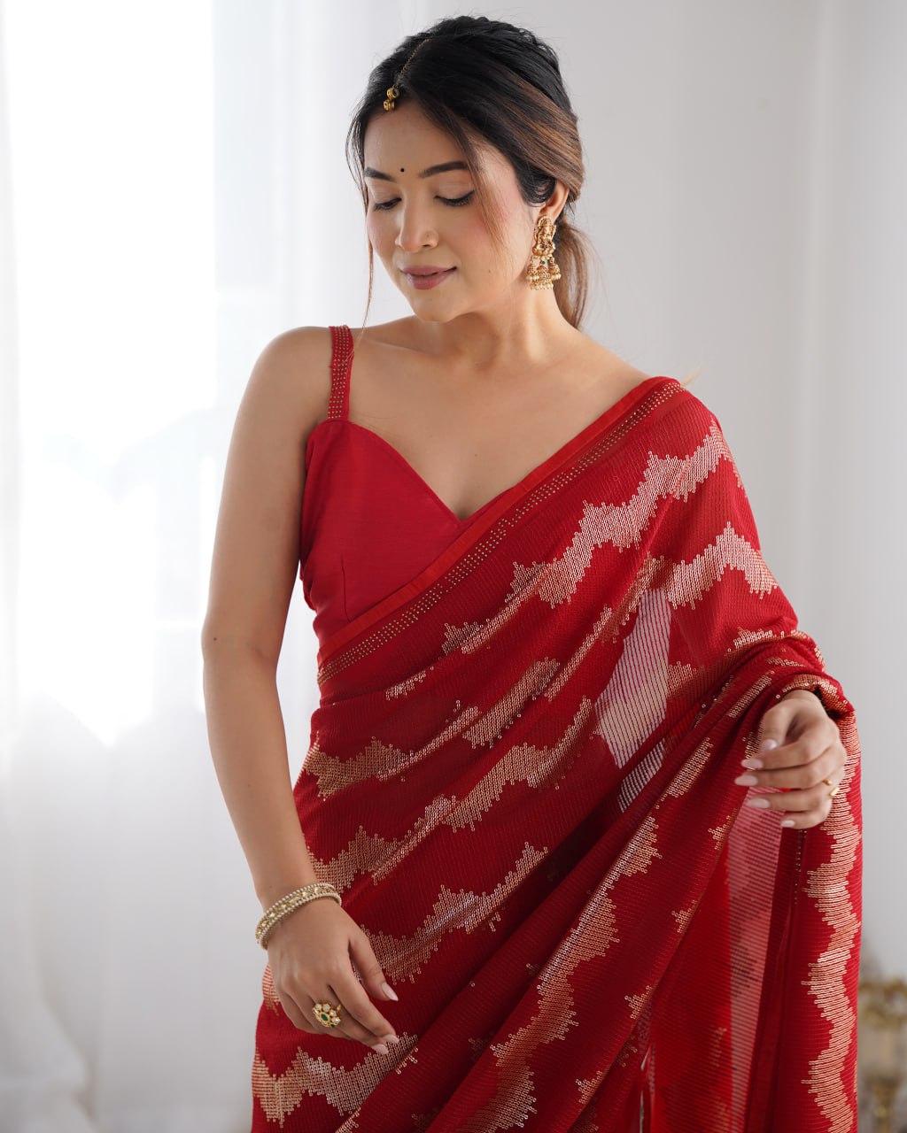 Red georgette saree with sequin & Seroski diamond work, bridal party wear saree with satin blouse, designer ethnic wear by Trinaari for weddings.