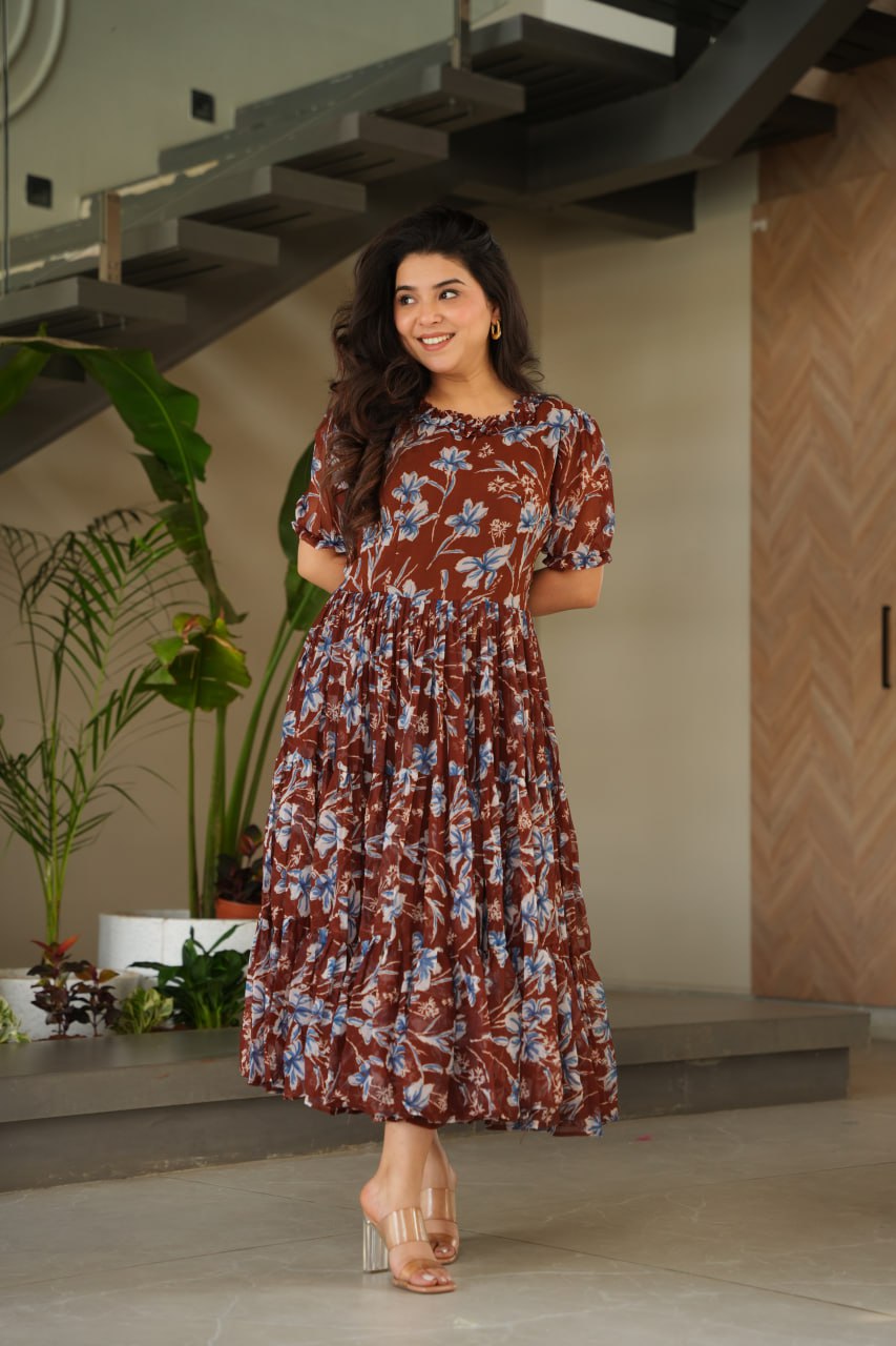 Vikarni Brown Printed Anarkali Gown in faux georgette with 12-meter flair & cotton lining – perfect for haldi, mehndi, festive & Indo-western occasions.