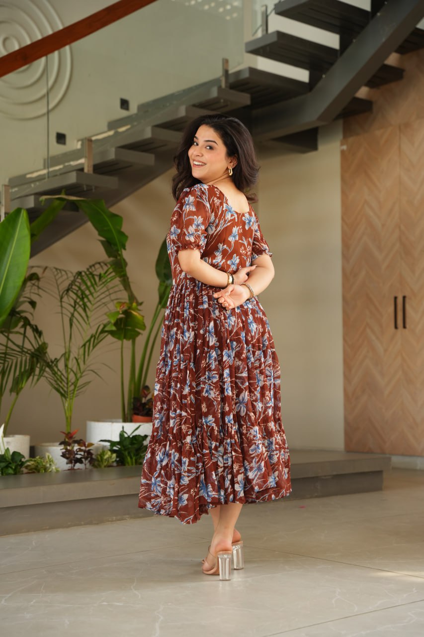 Vikarni Brown Printed Anarkali Gown in faux georgette with 12-meter flair & cotton lining – perfect for haldi, mehndi, festive & Indo-western occasions.