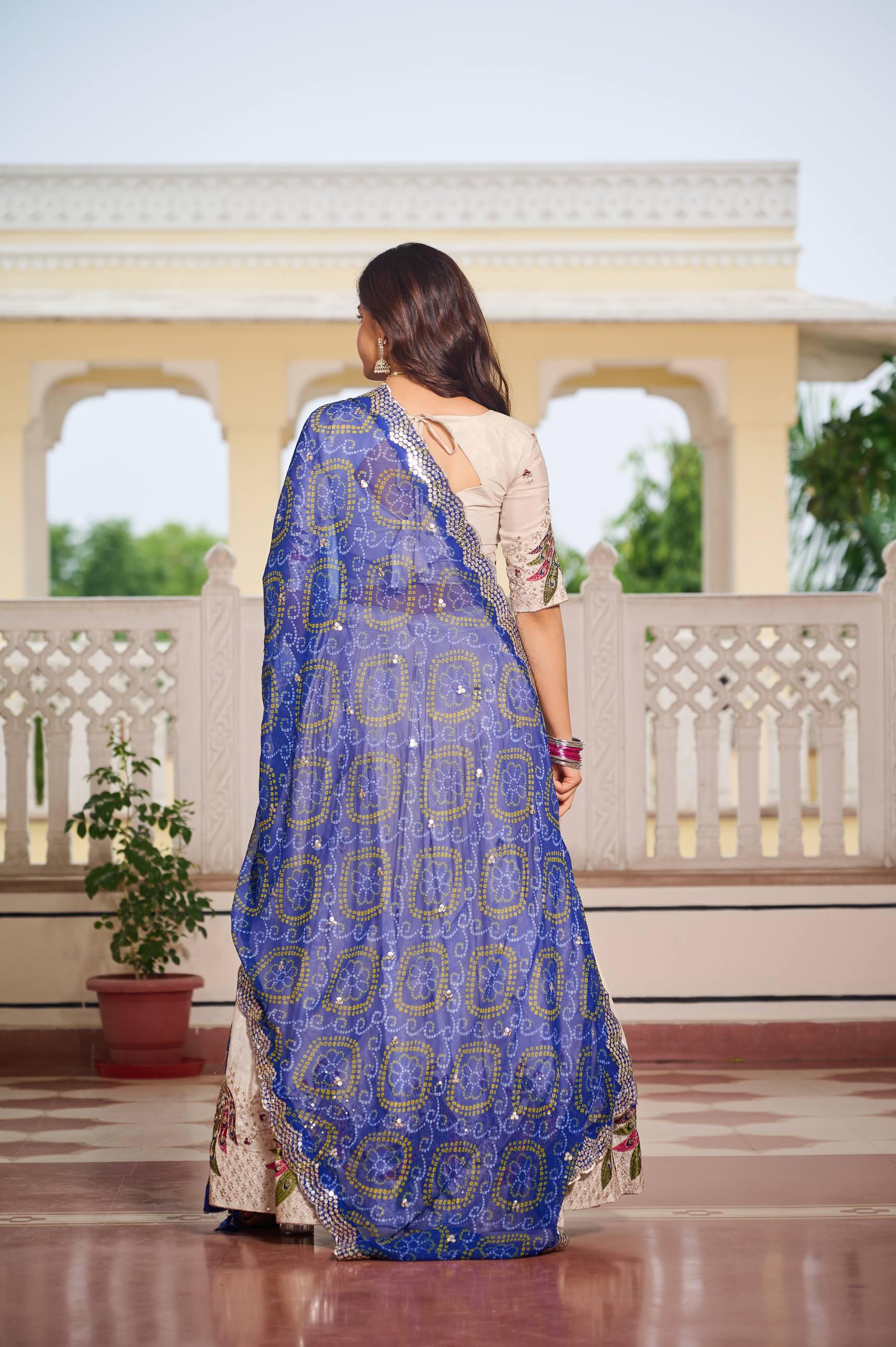 Amla Off-White Tissue Silk Sequins Thread Work Lehenga Choli with Blue Bandhej Dupatta