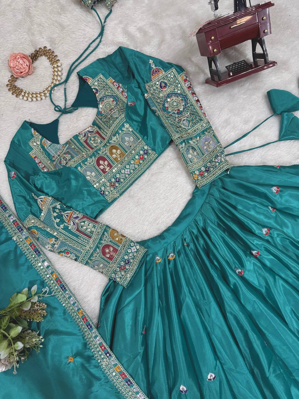 Kavyani Natural Crepe Silk Teal Color Lehenga Choli Set – semi-stitched lehenga with 3-meter flair, cancan and canvas patta, intricately embroidered with coding dori, thread, and sequins; paired with unstitched matching choli and embroidered dupatta with lace border, premium festive and wedding ethnic wear for women by Trinaari.