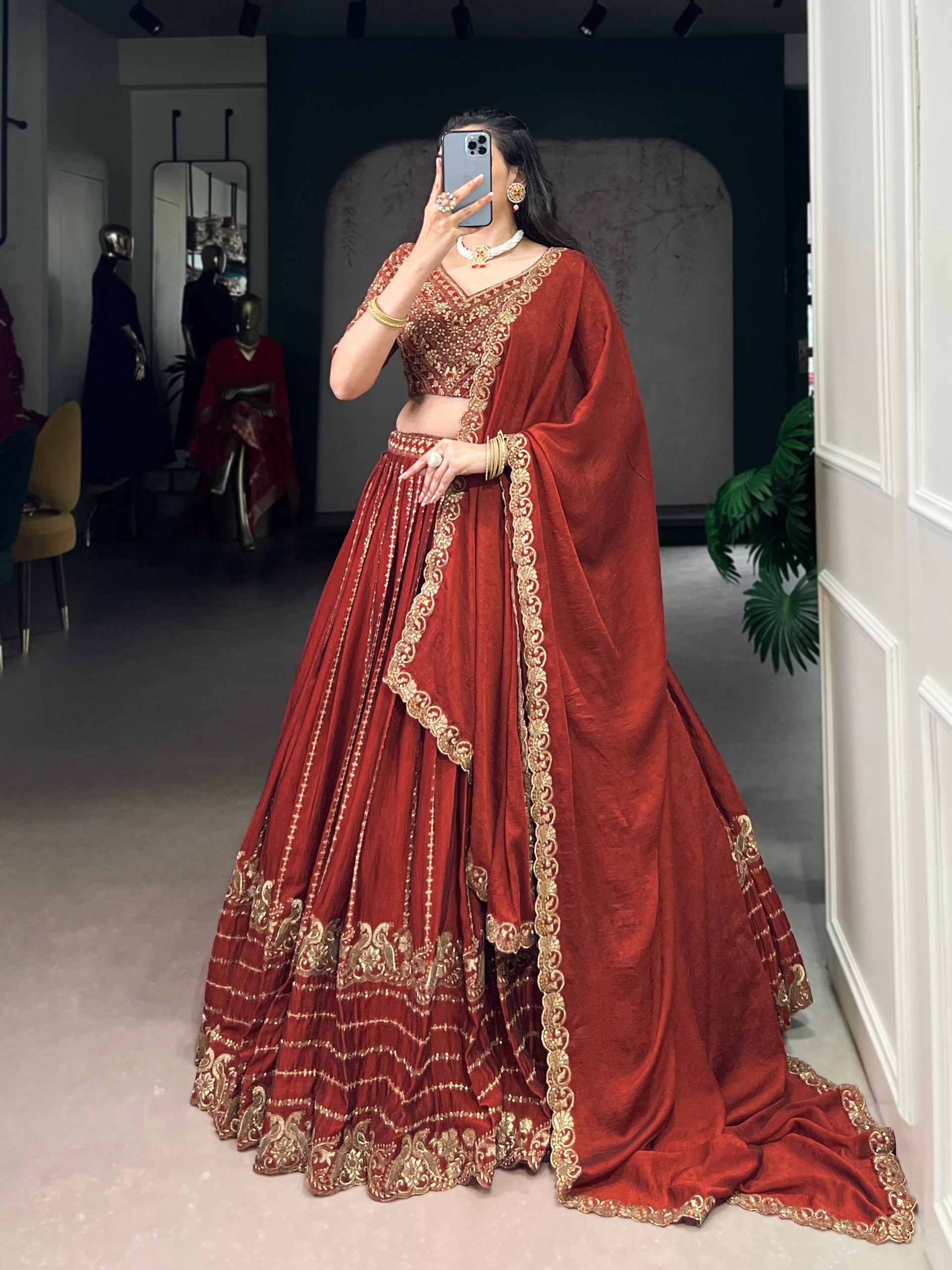 Rust orange silk lehenga choli with sequins thread embroidery
