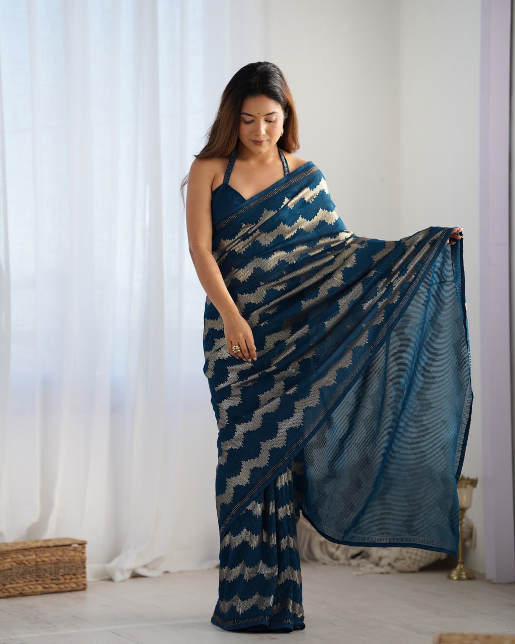 Elegant Aira Blue Georgette saree featuring heavy sequin embroidery and Seroski diamond work, paired with an unstitched satin Banglori blouse – perfect as a wedding saree, party wear saree, festive wear outfit, designer ethnic saree, and a must-have for lovers of premium georgette sarees.