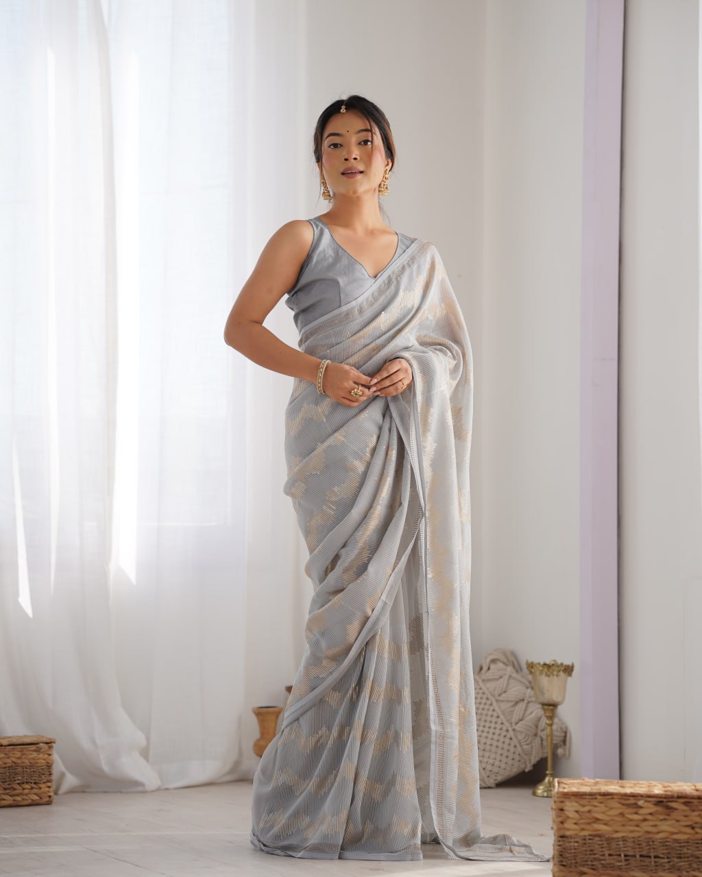 Graceful Aira Grey Georgette saree with heavy sequin embroidery and Seroski diamond embellishments, paired with an unstitched satin Banglori blouse – ideal bridal saree, festive saree, designer grey saree, elegant ethnic party wear, and luxury embroidered saree for women.