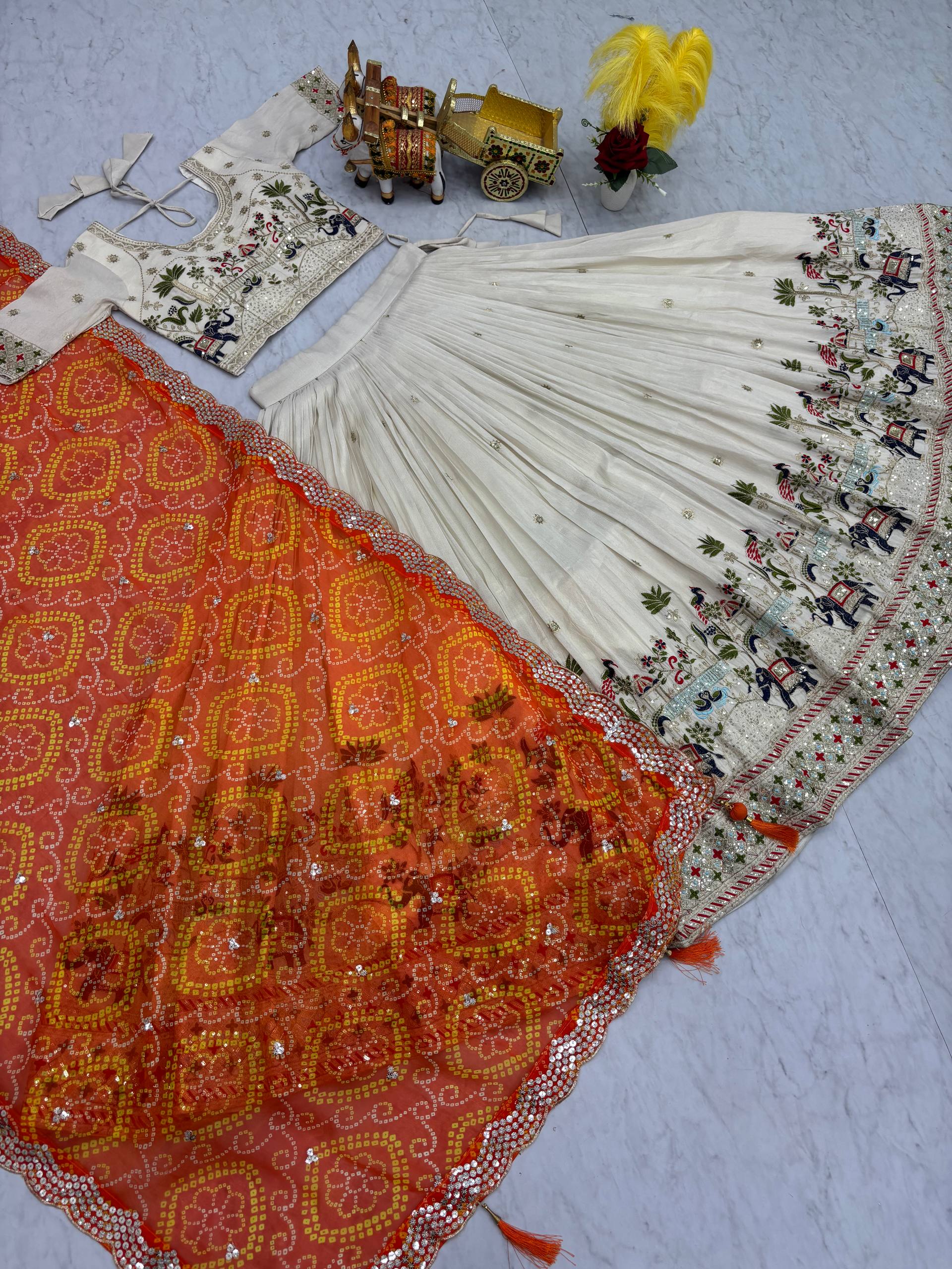 Off-white silk sequins thread embroidery lehenga choli with orange Bandhej dupatta