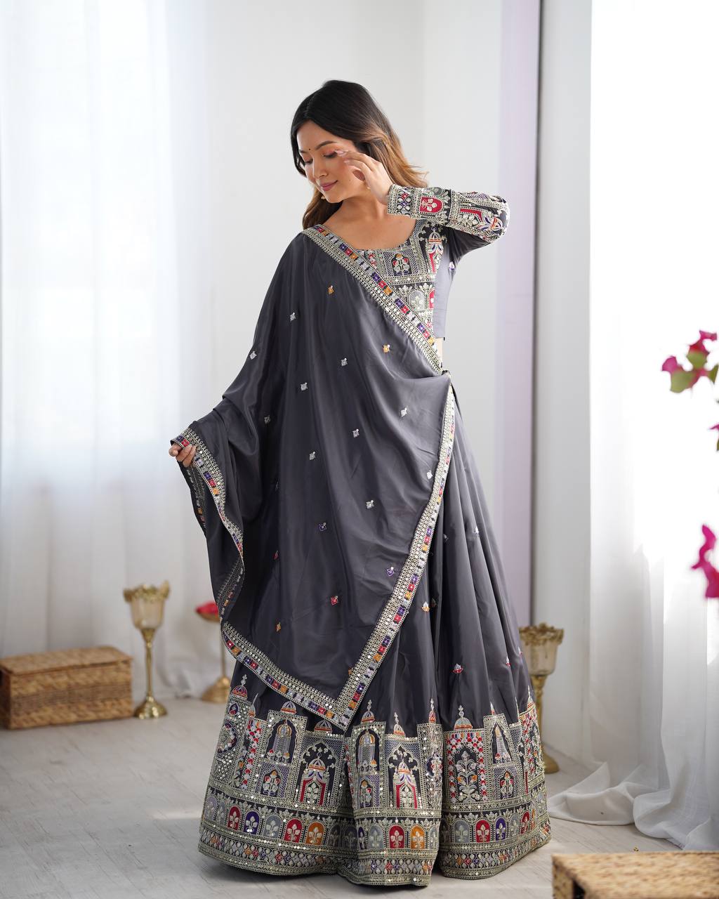 Kavyani Natural Crepe Silk Black Lehenga Choli Set – semi-stitched lehenga with 3-meter flair, cancan and canvas patta, intricately embroidered with coding dori, thread, and sequins; paired with unstitched matching choli and embroidered dupatta with lace border, premium festive and wedding ethnic wear for women by Trinaari.