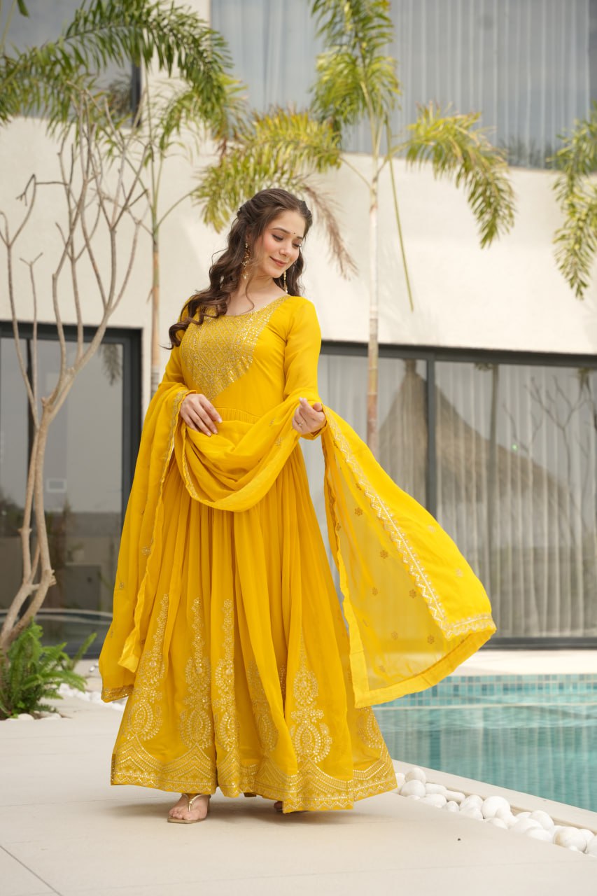 Yellow wedding gown for women with dupatta, embroidered gown design, full sleeve gown, Indian ethnic gown, stitched designer gown by Trinaari.