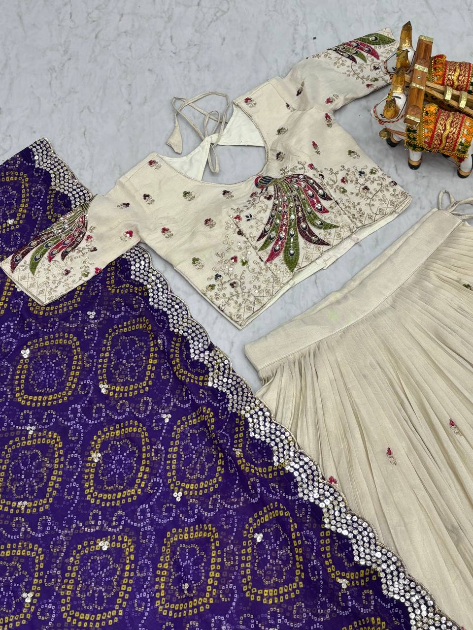 Amla Off-White Tissue Silk Sequins Thread Work Lehenga Choli with Purple Bandhej Dupatta
