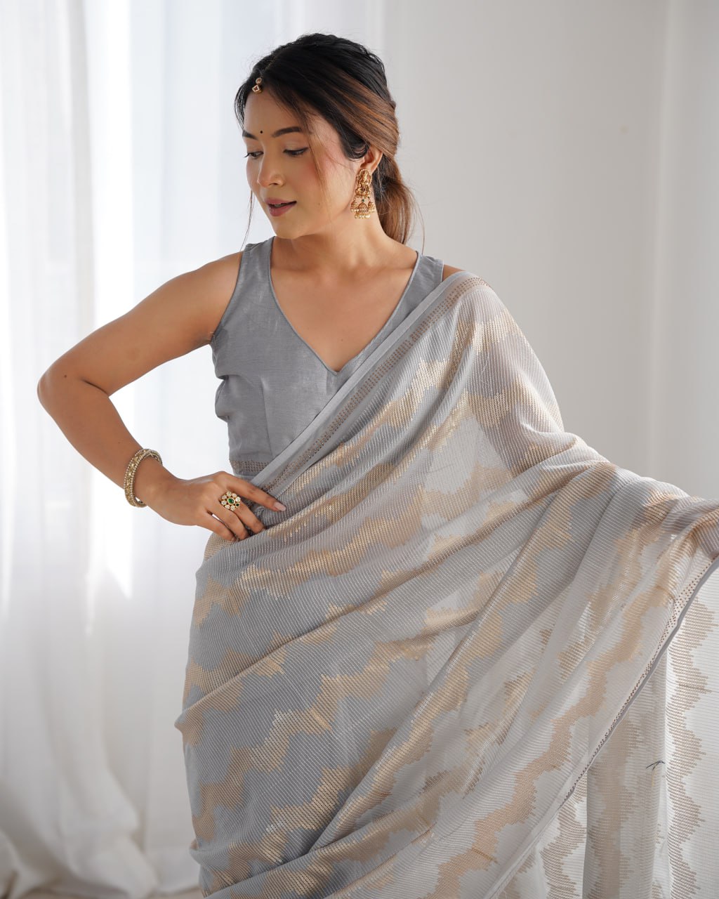 Graceful Aira Grey Georgette saree with heavy sequin embroidery and Seroski diamond embellishments, paired with an unstitched satin Banglori blouse – ideal bridal saree, festive saree, designer grey saree, elegant ethnic party wear, and luxury embroidered saree for women.