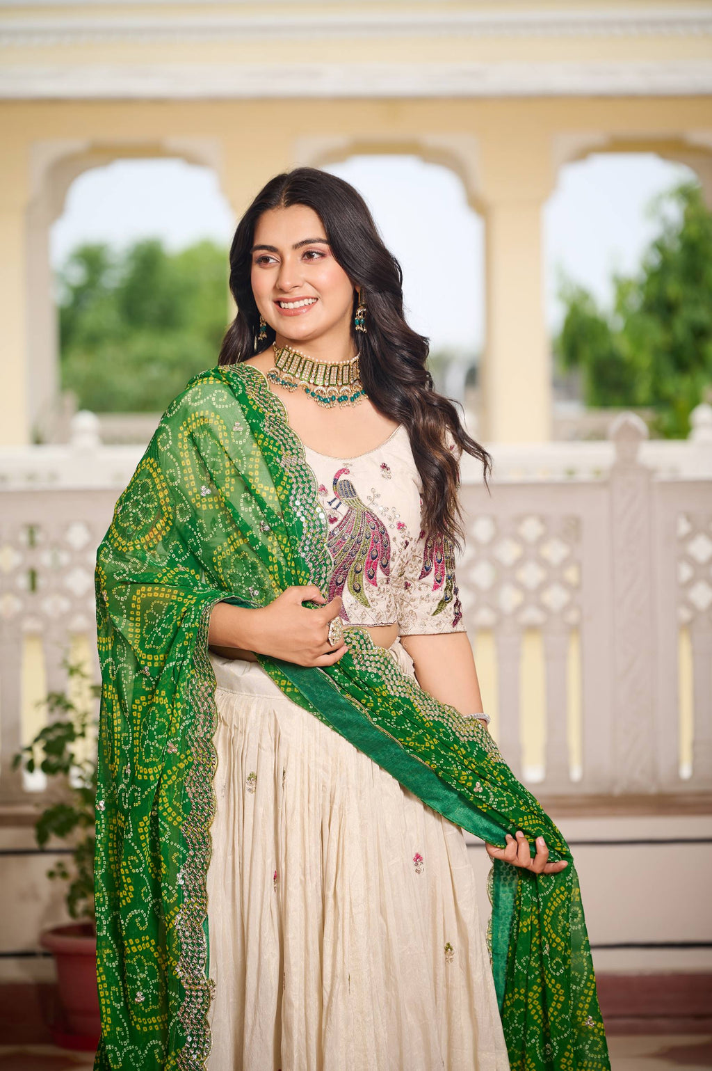 Amla off-white tissue silk lehenga choli with sequins thread work and green Bandhej dupatta