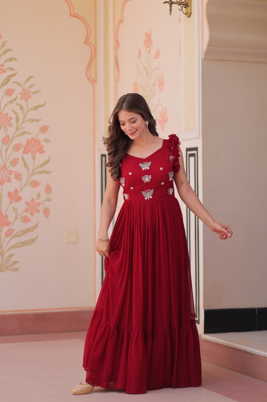 Lavi 7-meter flared designer gown in faux blooming fabric with sequin & bead embroidery, V-neck & frill shoulders – perfect for weddings & parties.