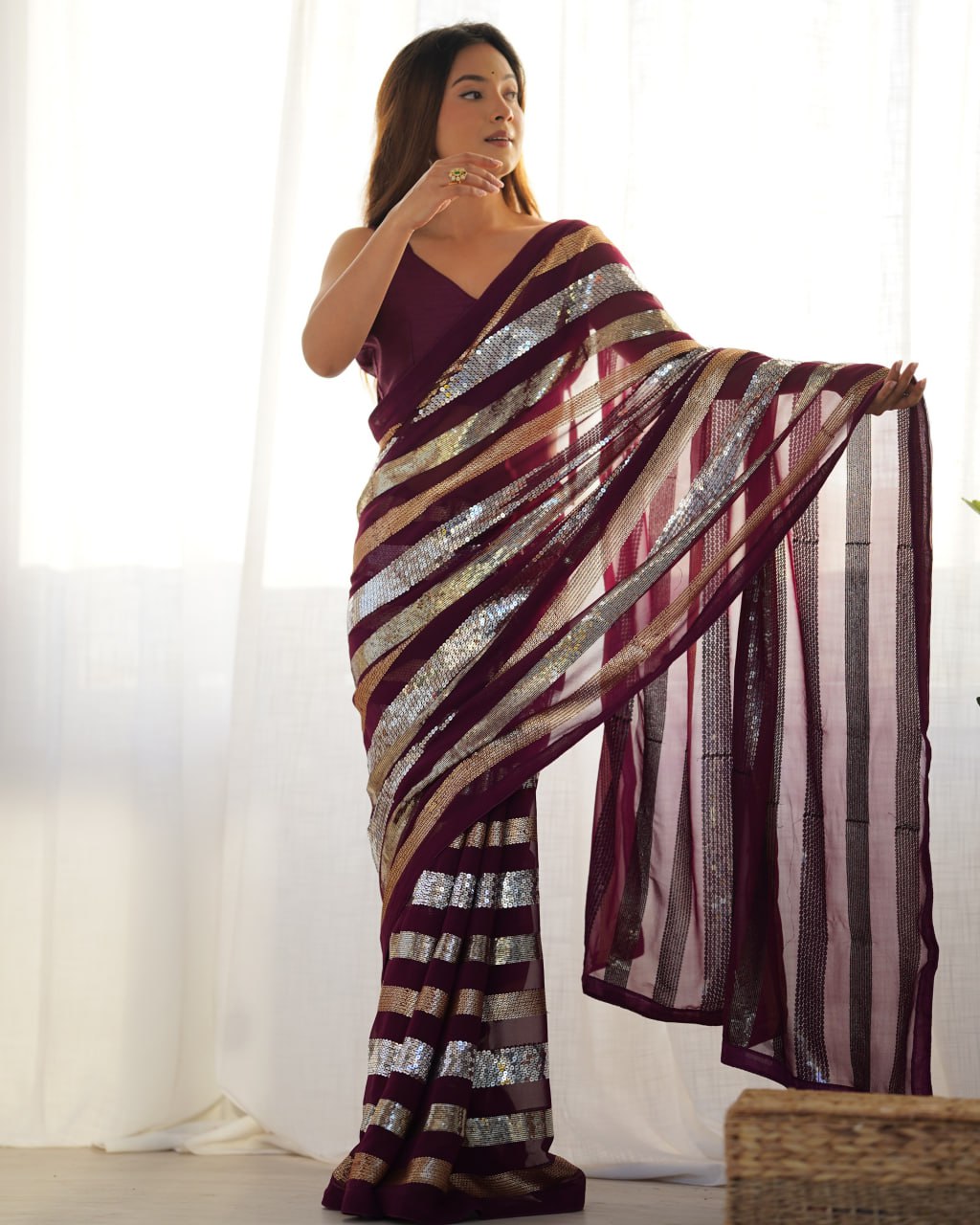 Kira Wine Georgette Saree with 3MM to 7MM sequin embroidery, elegant lining pattern and mono Banglory blouse – ideal sequin saree for wedding receptions, cocktail parties, festive wear, and premium Bollywood-style designer look.