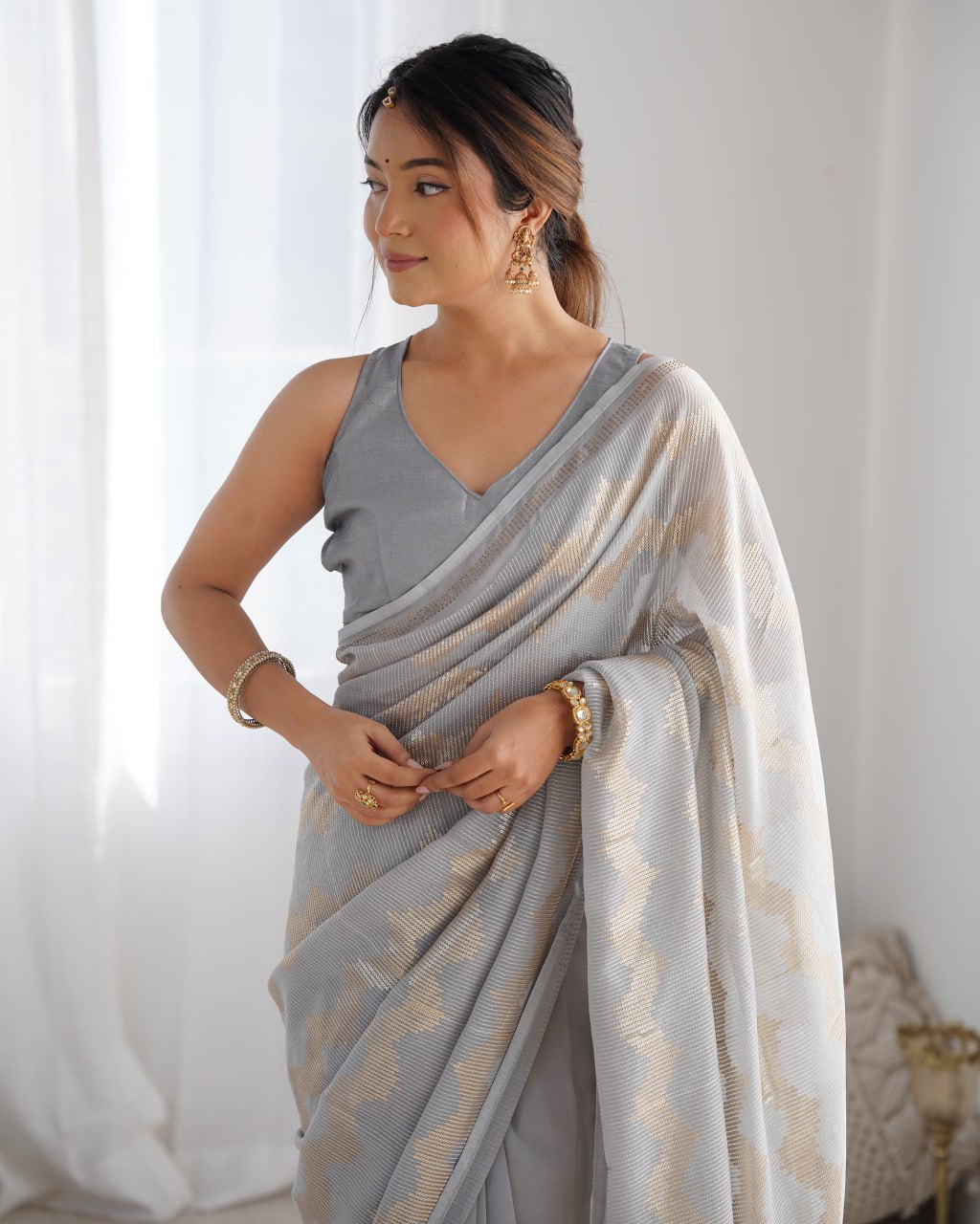 Graceful Aira Grey Georgette saree with heavy sequin embroidery and Seroski diamond embellishments, paired with an unstitched satin Banglori blouse – ideal bridal saree, festive saree, designer grey saree, elegant ethnic party wear, and luxury embroidered saree for women.