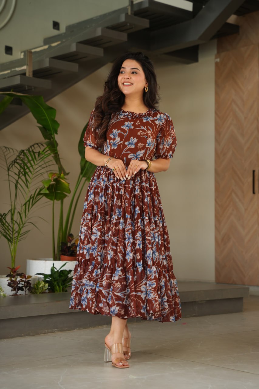Vikarni Brown Printed Anarkali Gown in faux georgette with 12-meter flair & cotton lining – perfect for haldi, mehndi, festive & Indo-western occasions.