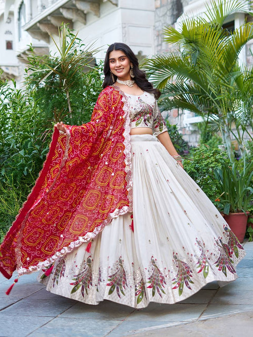Amla off-white tissue silk lehenga choli with sequins thread work and red Bandhej dupatta