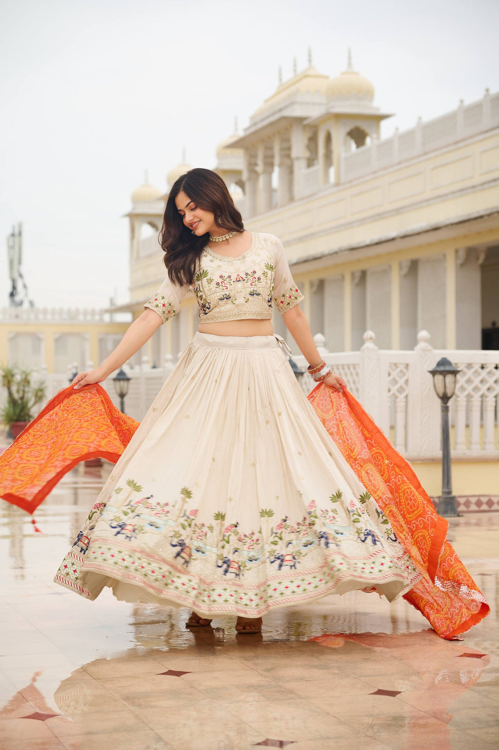 Off-white silk sequins thread embroidery lehenga choli with orange Bandhej dupatta