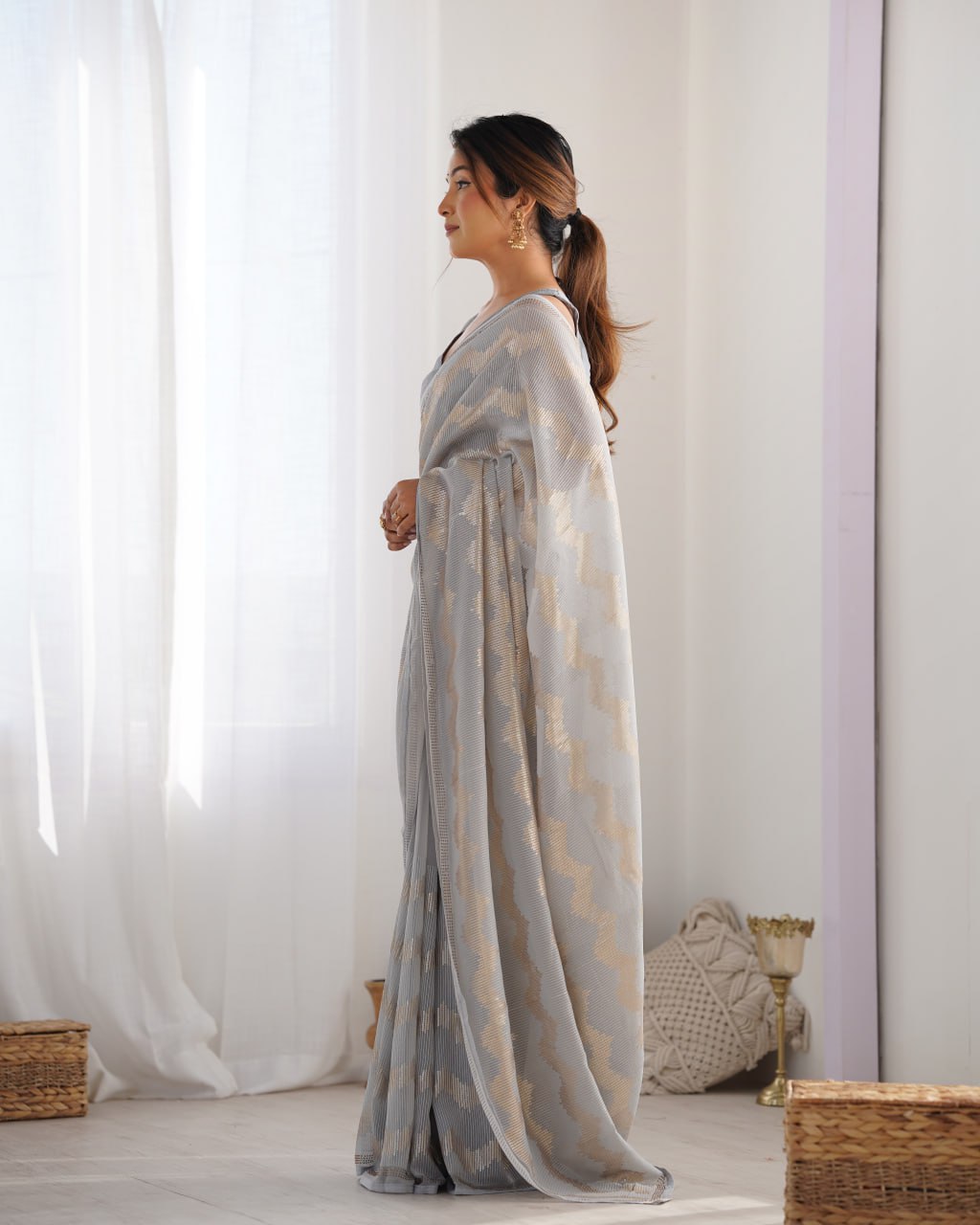 Graceful Aira Grey Georgette saree with heavy sequin embroidery and Seroski diamond embellishments, paired with an unstitched satin Banglori blouse – ideal bridal saree, festive saree, designer grey saree, elegant ethnic party wear, and luxury embroidered saree for women.