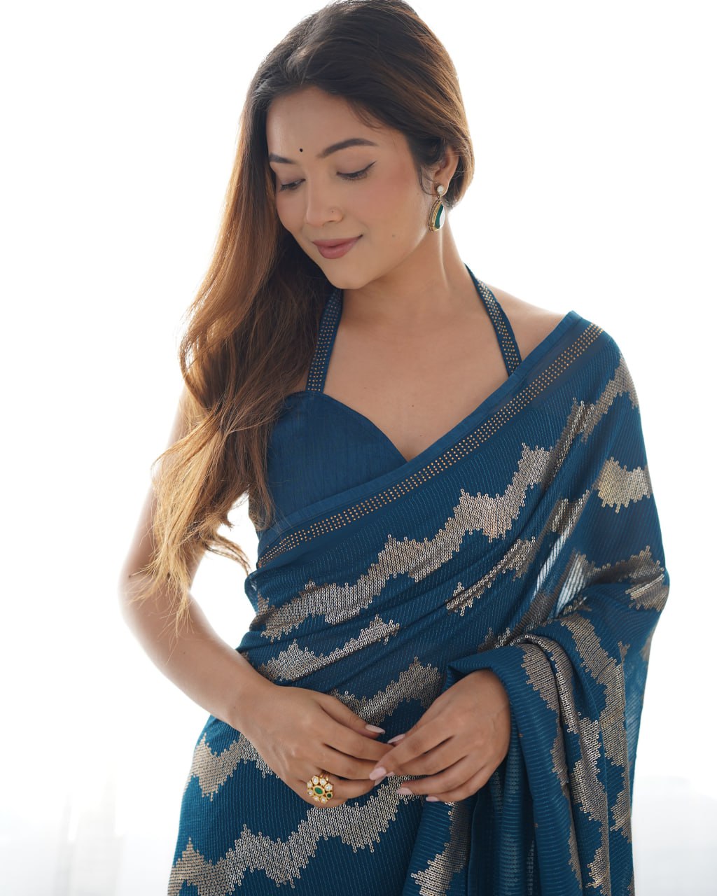 Elegant Aira Blue Georgette saree featuring heavy sequin embroidery and Seroski diamond work, paired with an unstitched satin Banglori blouse – perfect as a wedding saree, party wear saree, festive wear outfit, designer ethnic saree, and a must-have for lovers of premium georgette sarees.